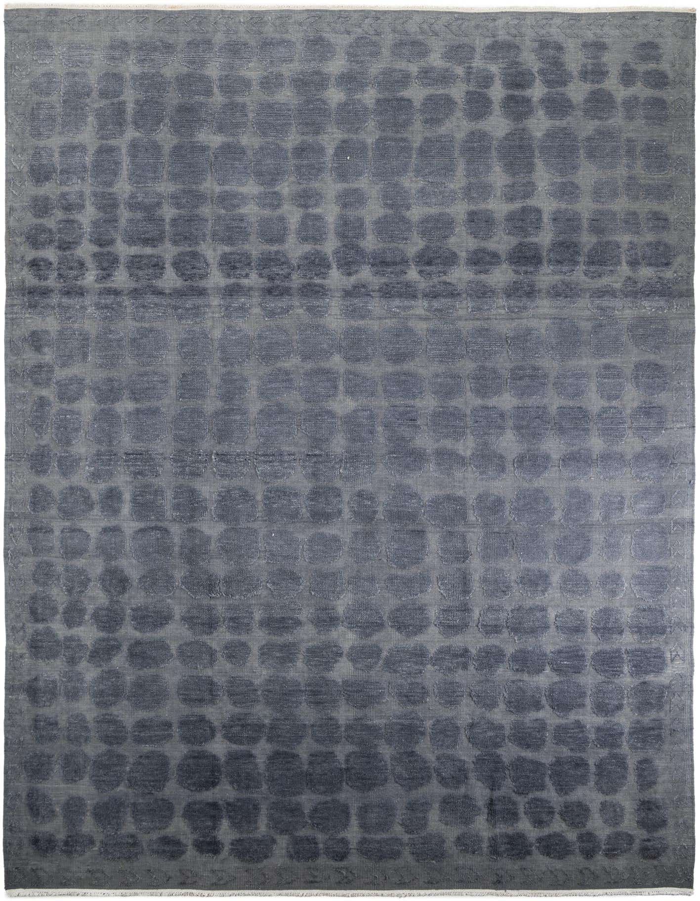 A 10x14 rectangular gray wool area rug with a modern abstract pattern of varying circular shapes.