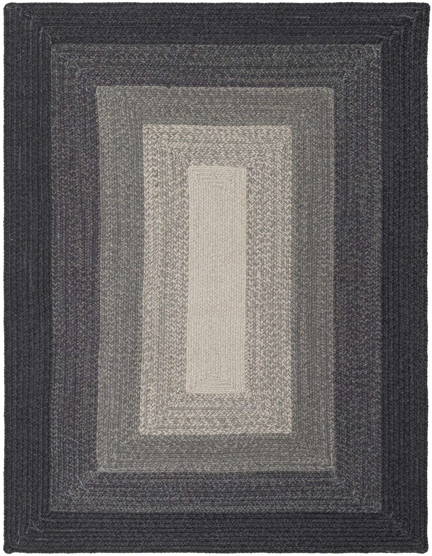 A 4x6 rectangular Hand Braided Wool rug by Rugs.com featuring a modern stripe pattern in varying shades of gray, from dark charcoal to light silver, suitable for a living room or bedroom.