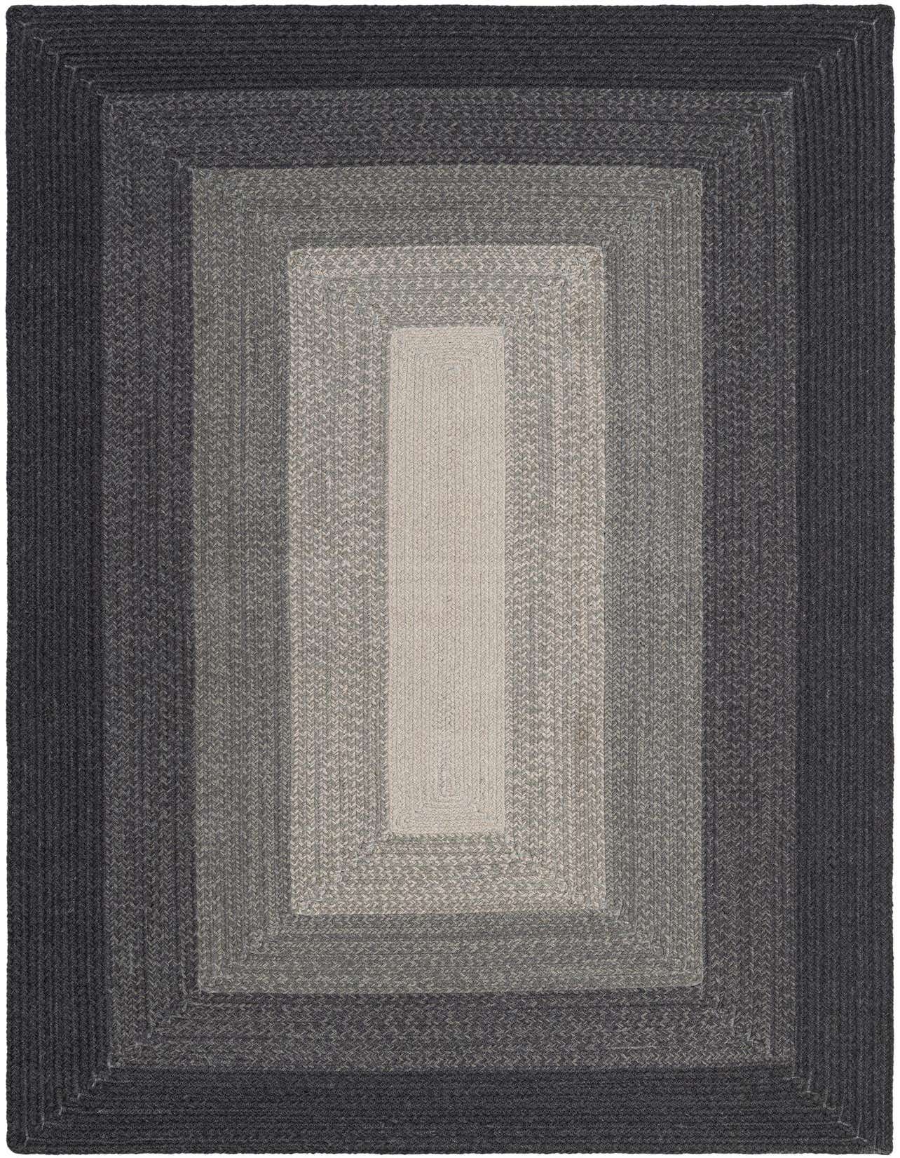 A 5x8 rectangular Hand Braided Wool rug by Rugs.com, featuring a modern ombre design with concentric shades of gray.
