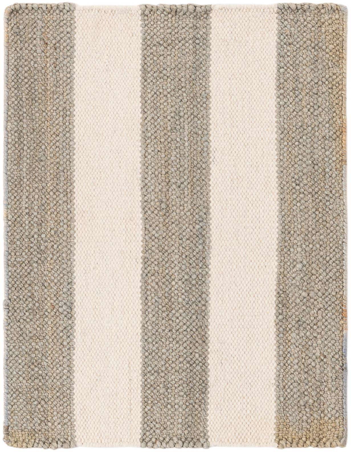 A 2x3 rectangular Jill Zarin Hamptons rug with wide gray and cream stripes, showcasing its textured jute and wool flatweave.