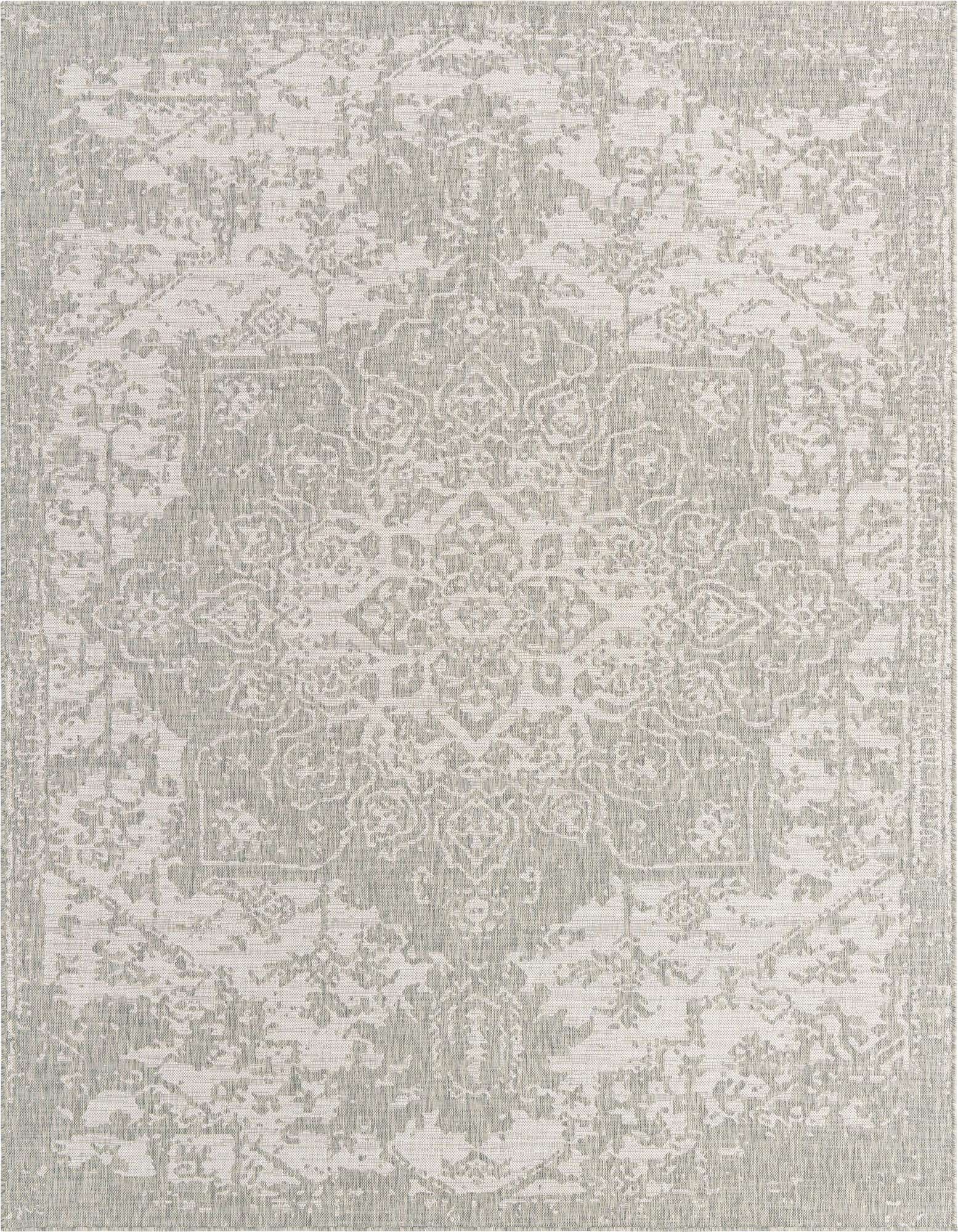 An 8x10 rectangular gray and silver indoor/outdoor rug with a distressed Mediterranean medallion pattern.