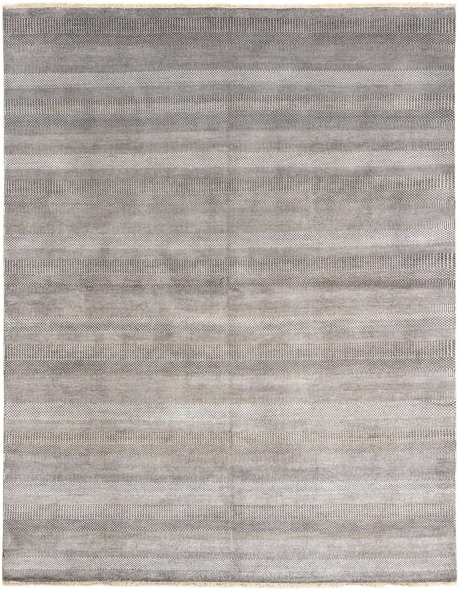 A 9x12 rectangular Kamla Persian rug in varying shades of gray, featuring textured horizontal stripes.