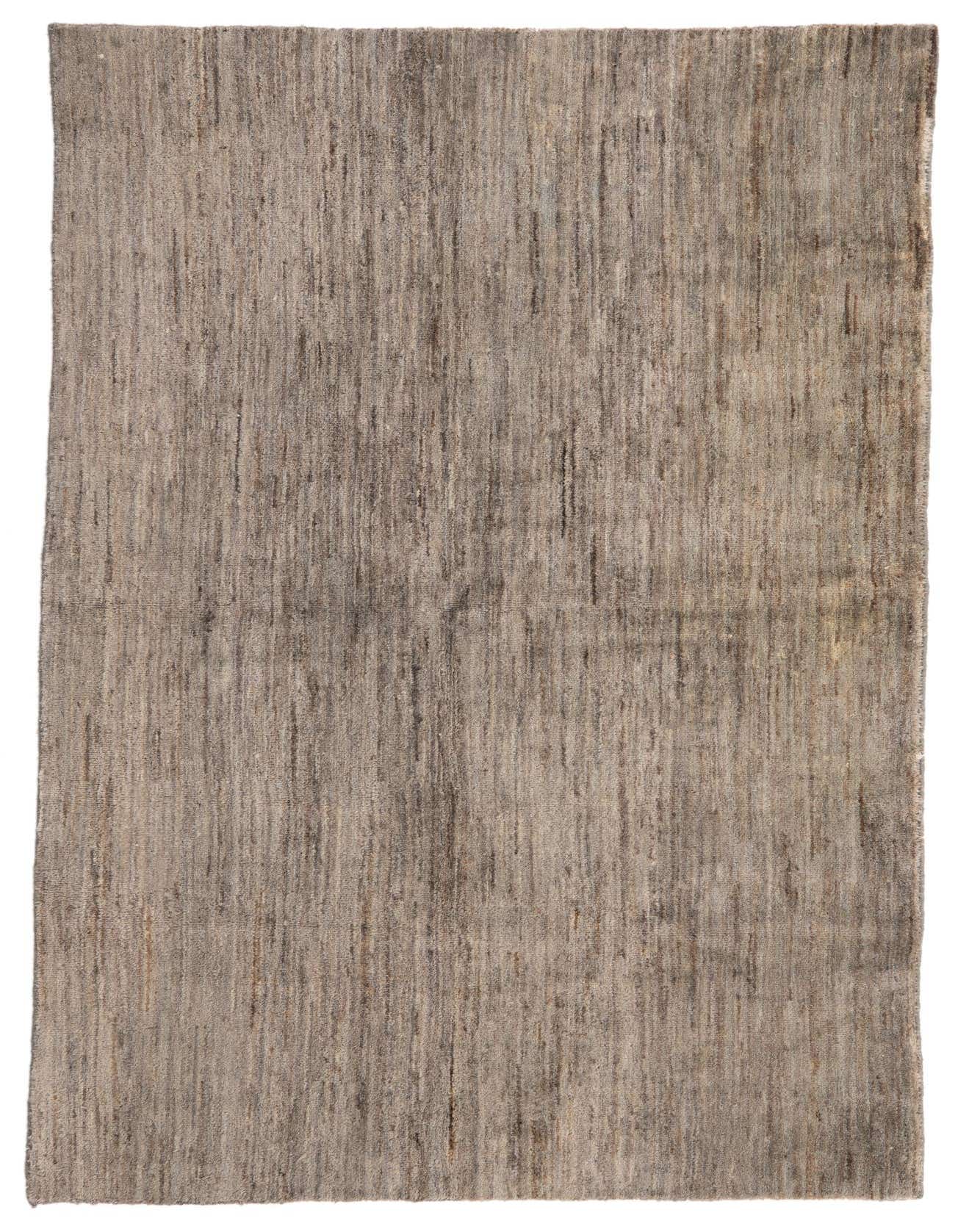 A 4x6 rectangular Kashkuli Gabbeh rug in varying shades of gray, featuring a modern solid pattern.