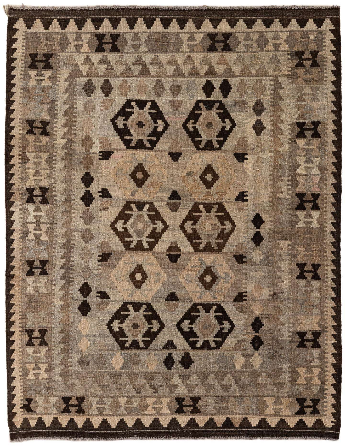 A 4x6 rectangular Kilim Maymana rug featuring a tribal geometric pattern in shades of gray, silver, and dark brown, suitable for an indoor living space.