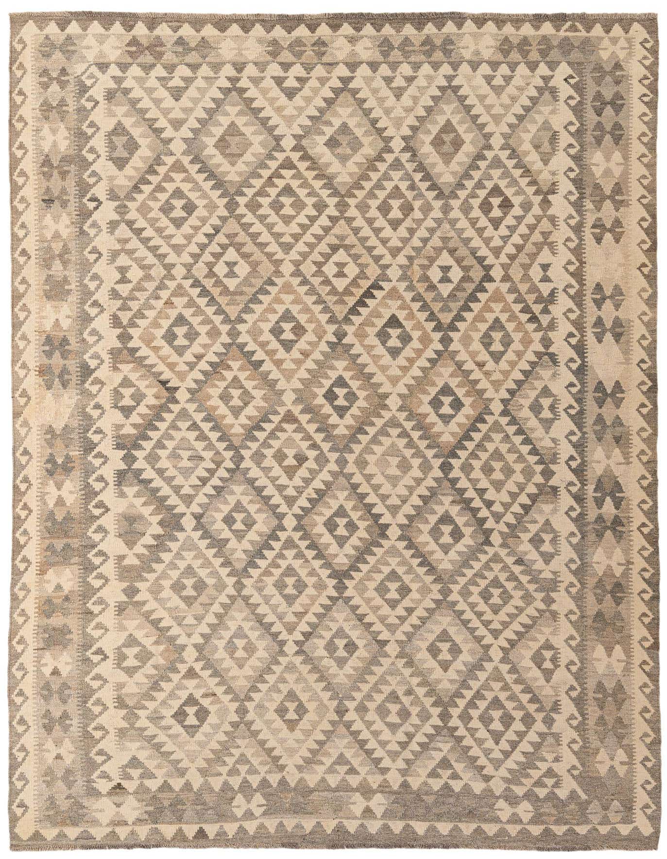 A 7x10 rectangular flatweave rug with a tribal geometric pattern in shades of gray and silver, suitable for a living room.