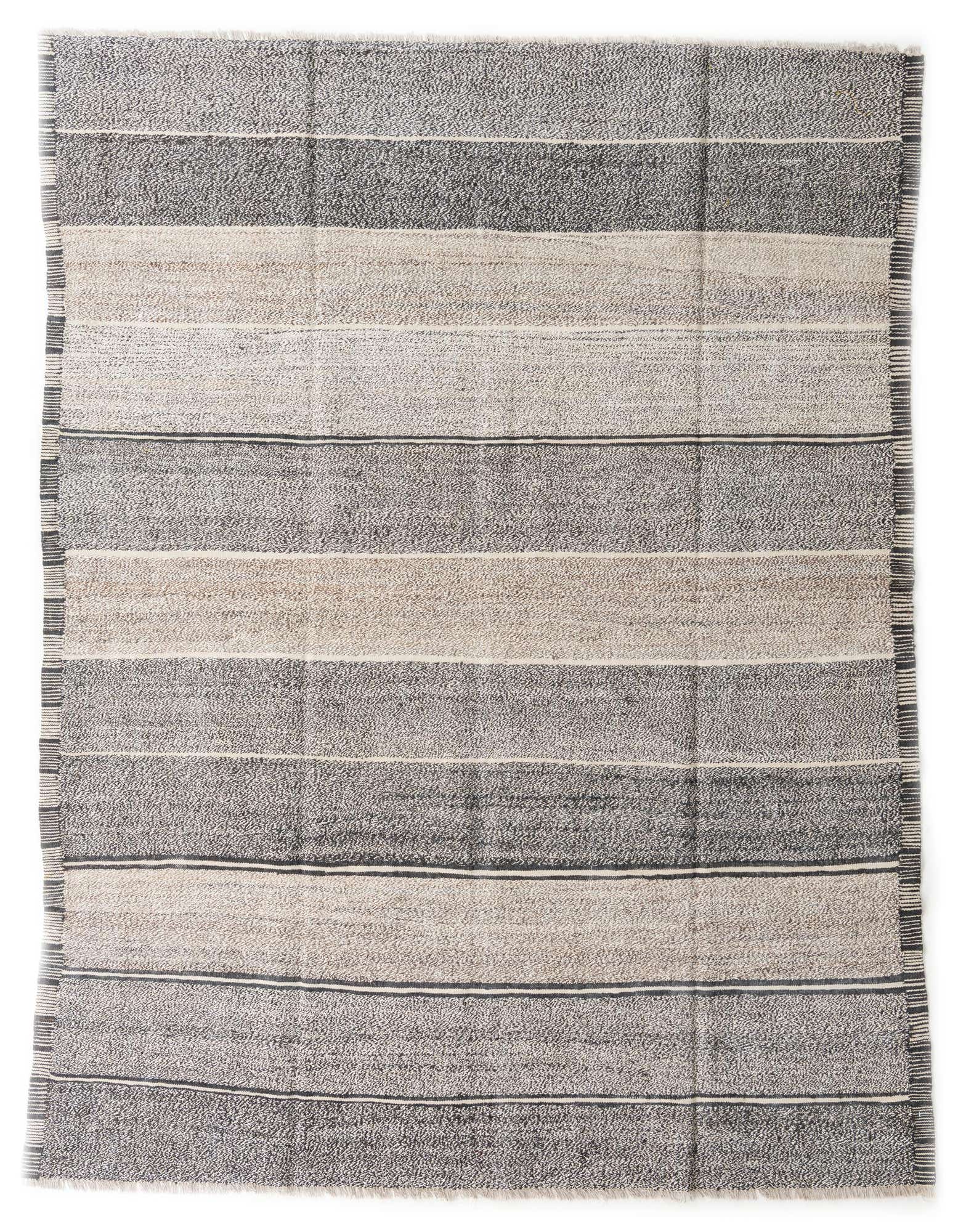 A rectangular 8x10 gray and silver striped wool flatweave rug with a tribal modern pattern.