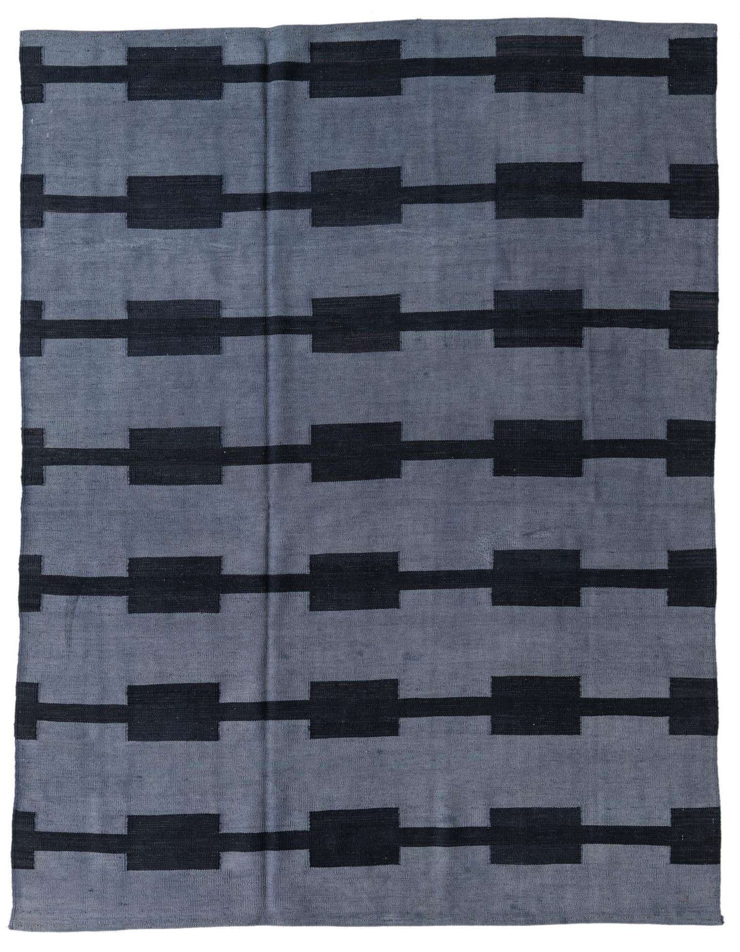 A 5x8 rectangular gray flatweave rug with a modern tribal pattern of horizontal black bars connecting black rectangles.