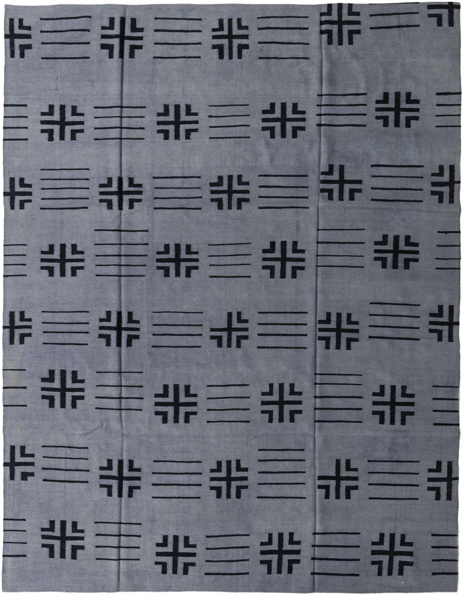 An 8x10 rectangular gray wool rug with a modern tribal pattern of black abstract symbols and horizontal lines.