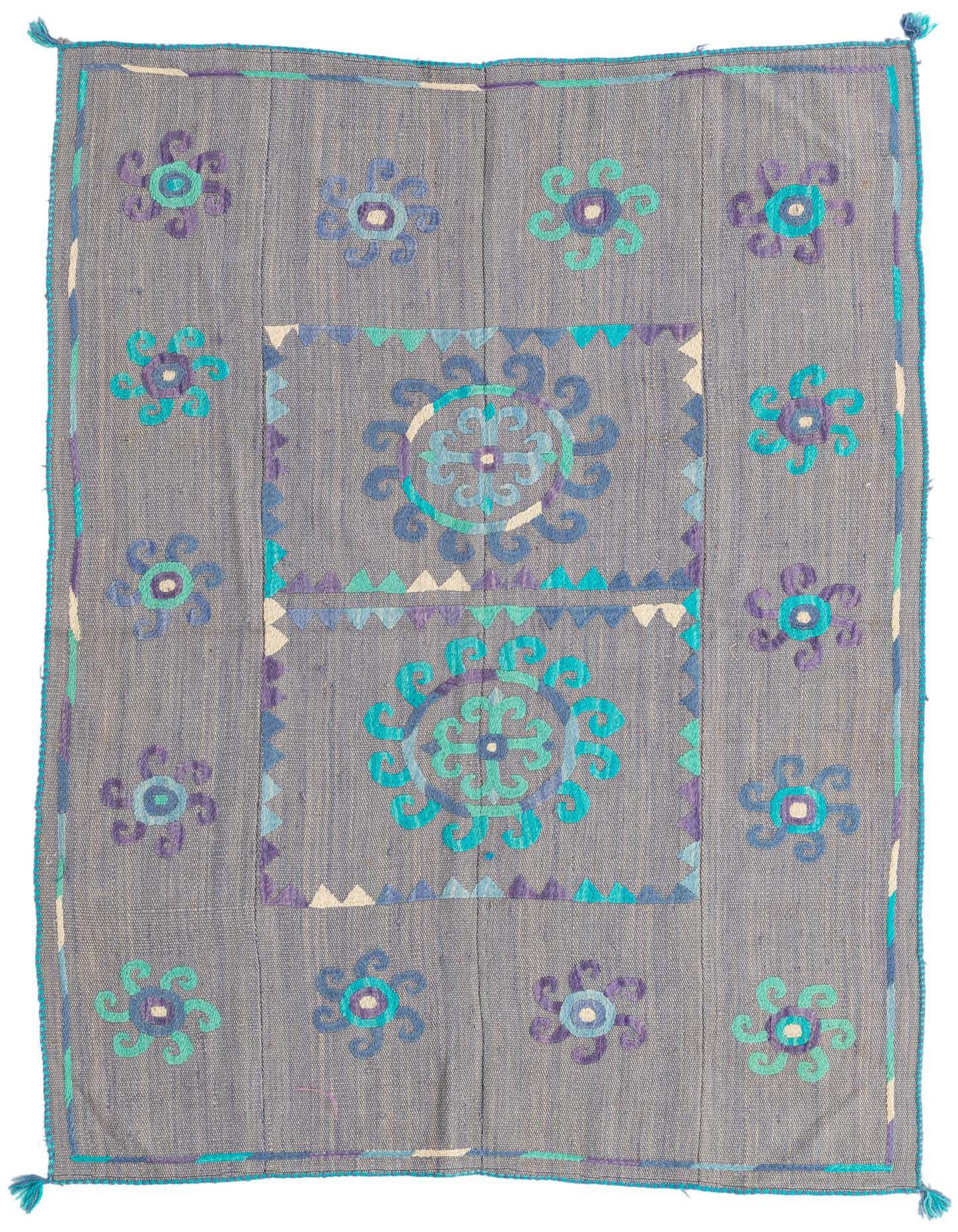 A 4x6 rectangular gray flatweave rug with a tribal Suzani pattern featuring teal, purple, and blue floral medallions.