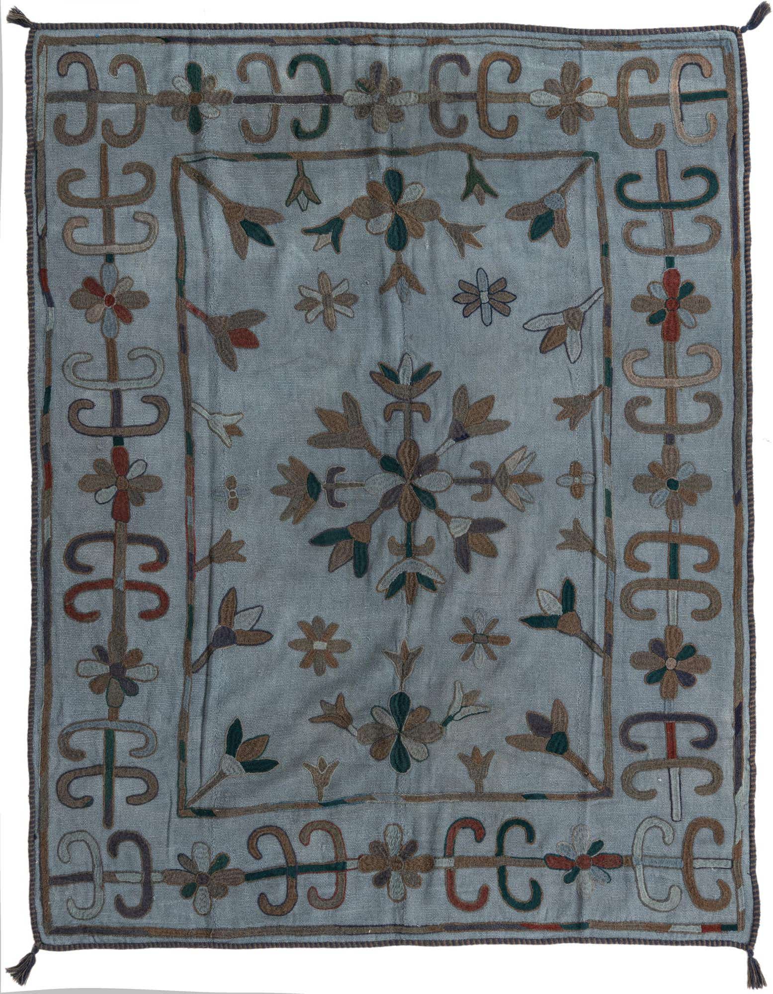 A 5x8 rectangular gray Kilim Suzani wool rug with intricate tribal and floral patterns in muted earth tones.