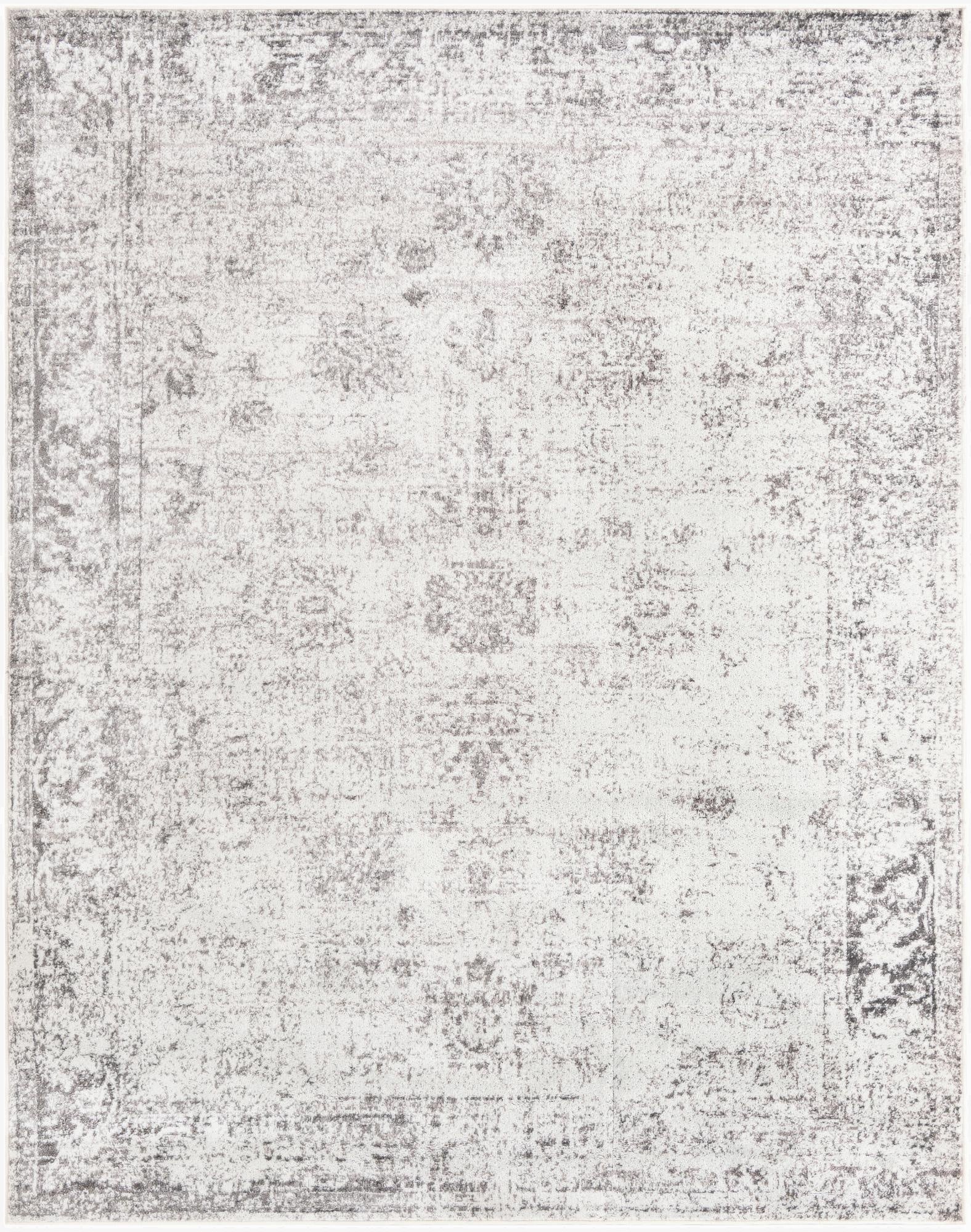 An 8x10 rectangular gray and silver area rug featuring a distressed bohemian medallion pattern, perfect for a living room.