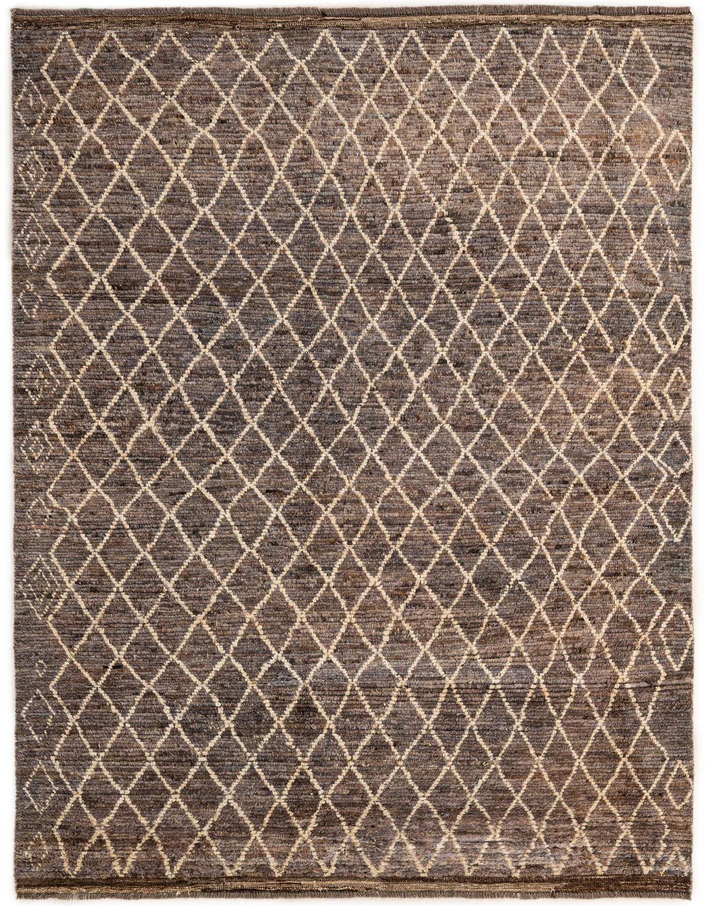 A 6x9 rectangular gray wool rug with a repeating off-white tribal diamond pattern, showcasing its handmade texture.