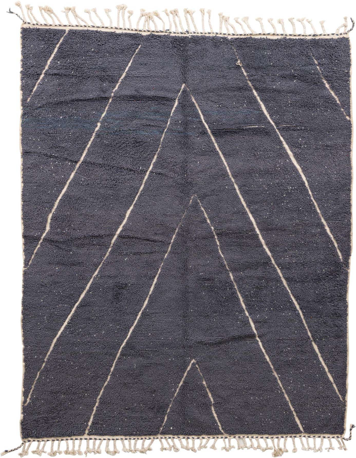 A 7x10 rectangular gray shag rug with a modern tribal pattern of off-white chevron lines and tassels.