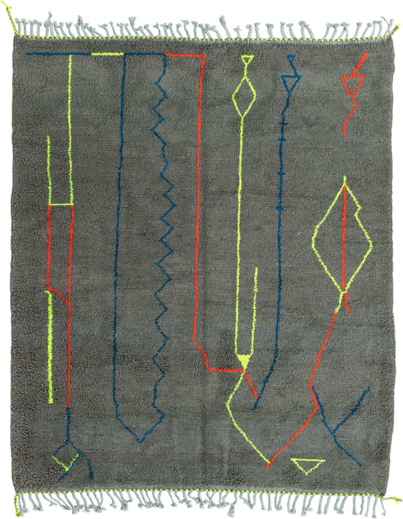 A 6x9 rectangular gray shag rug with vibrant abstract tribal patterns in neon yellow, red, and blue, featuring tassels.