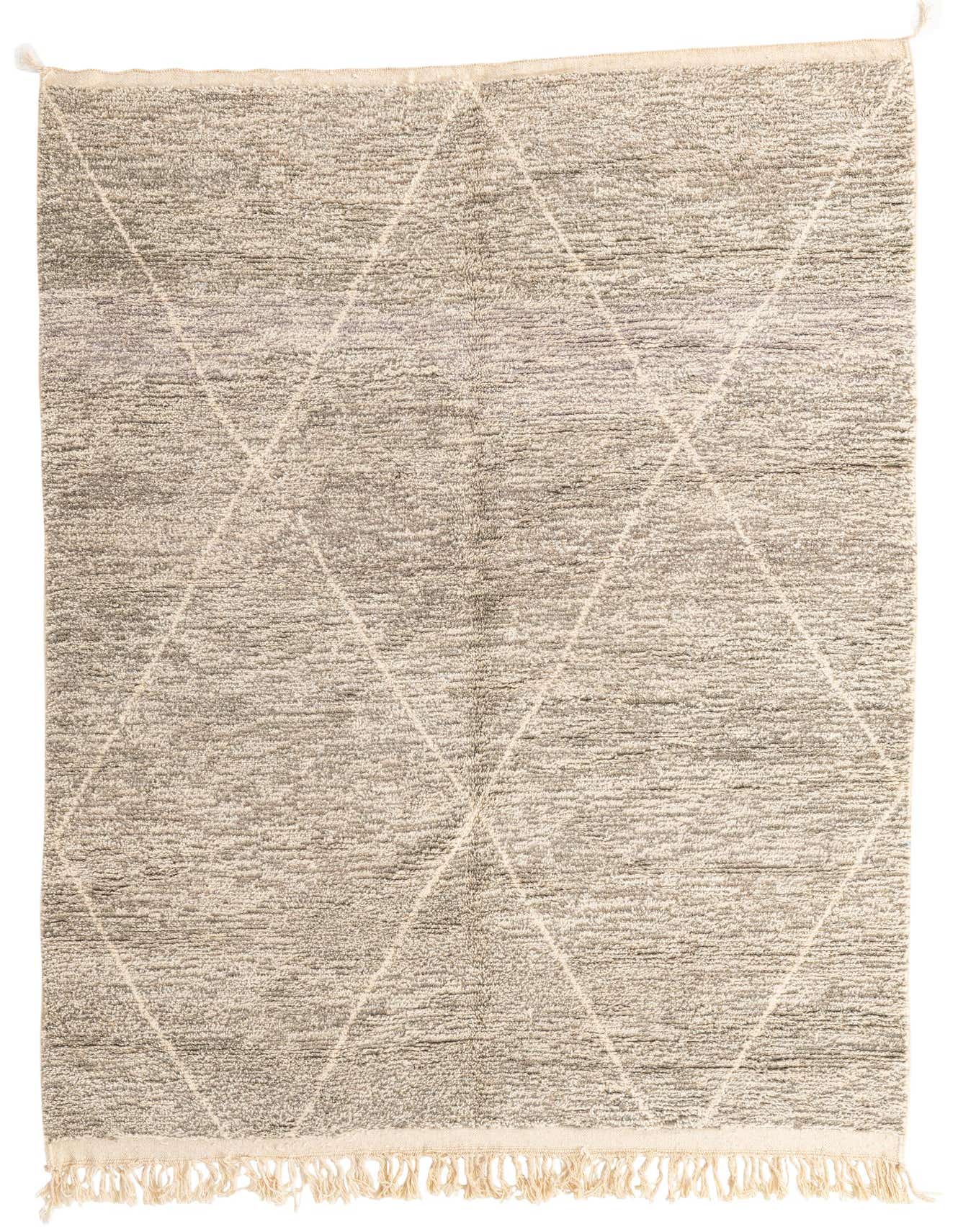 A 7x10 rectangular gray shag rug with a subtle cream tribal diamond pattern and fringed edges, ideal for a modern living room.