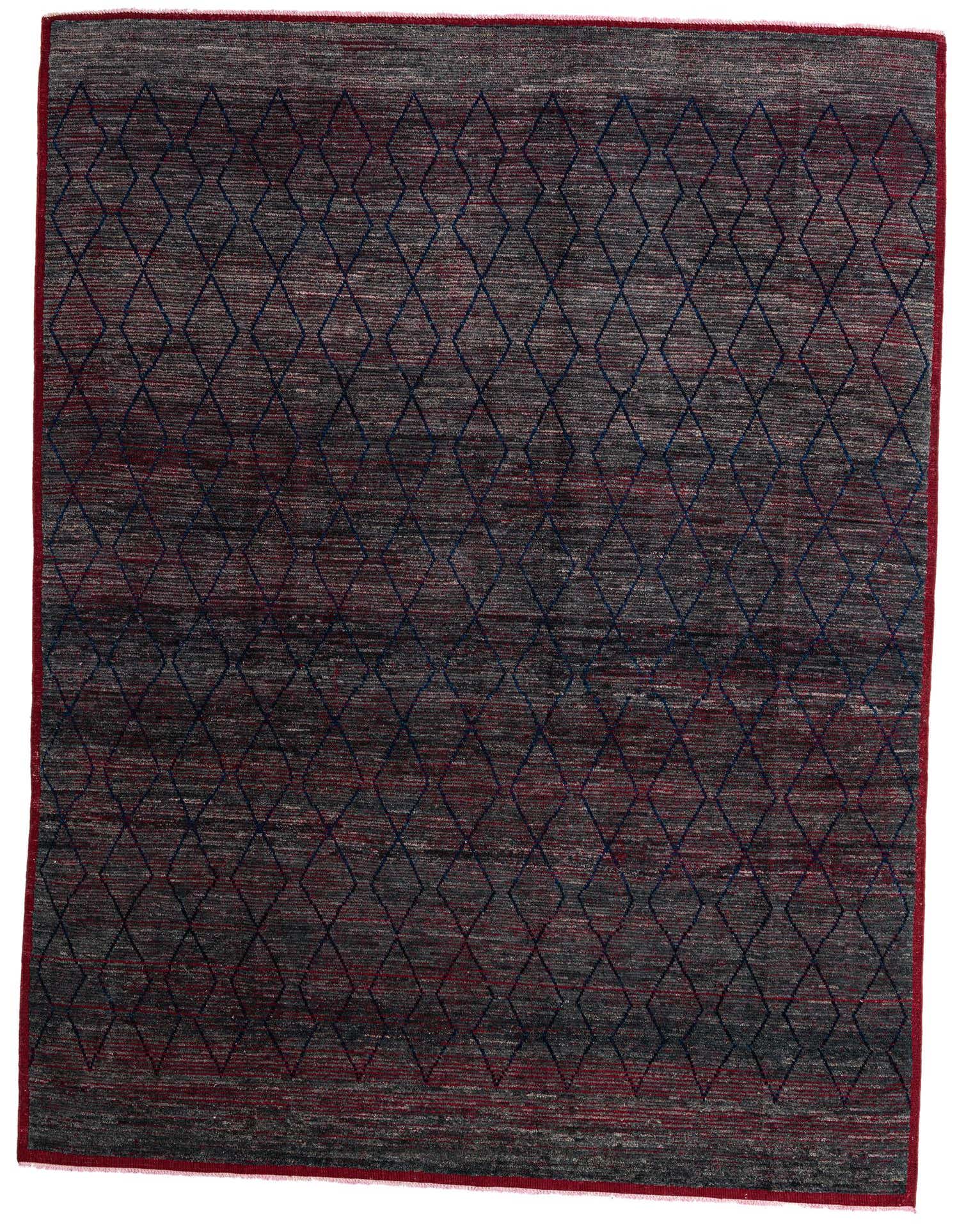 A 10x13 rectangular gray wool shag rug with a subtle tribal diamond pattern in dark blue and red, featuring a red border.