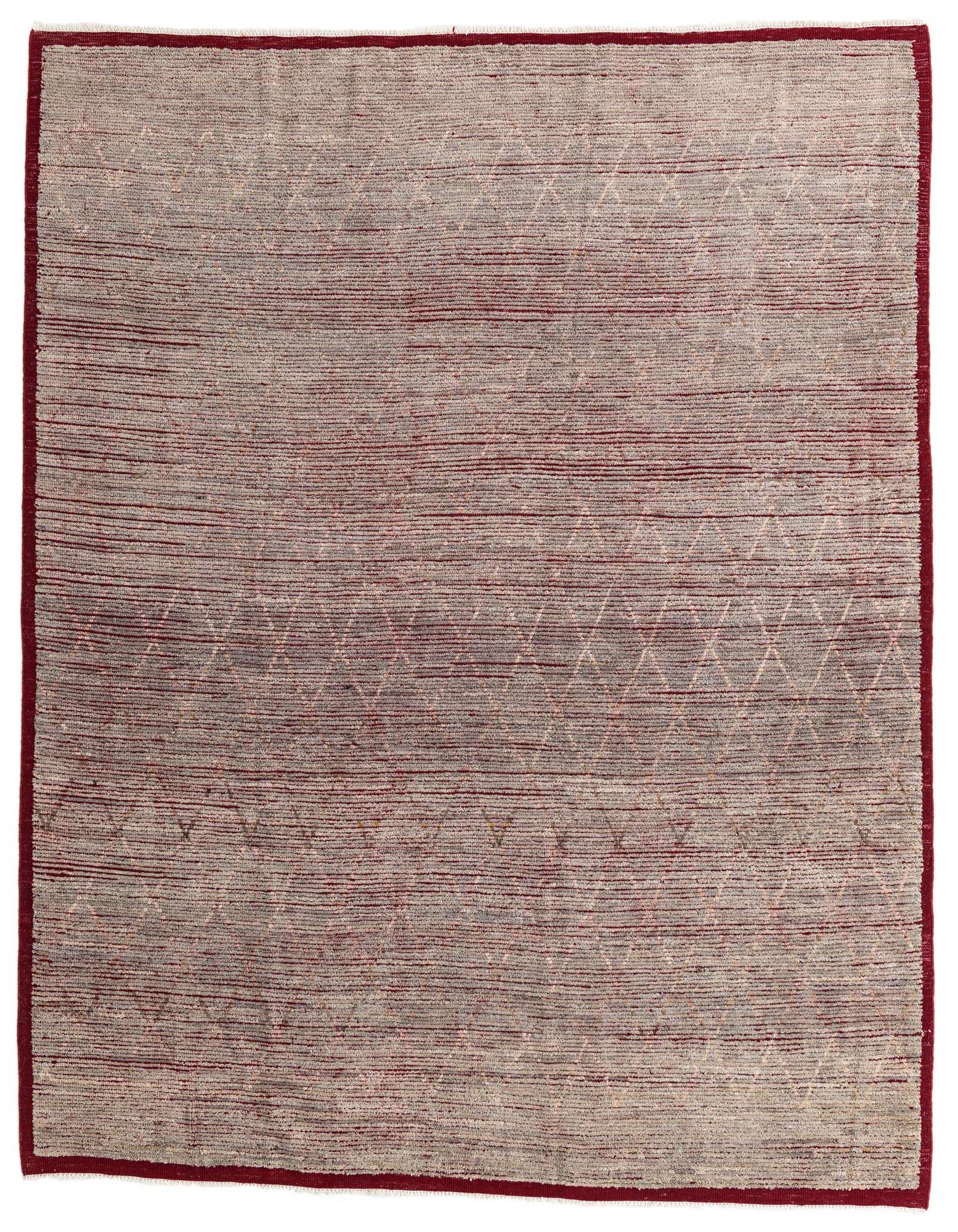 An 8x10 rectangular gray wool shag rug with subtle tribal diamond patterns and a deep red border.