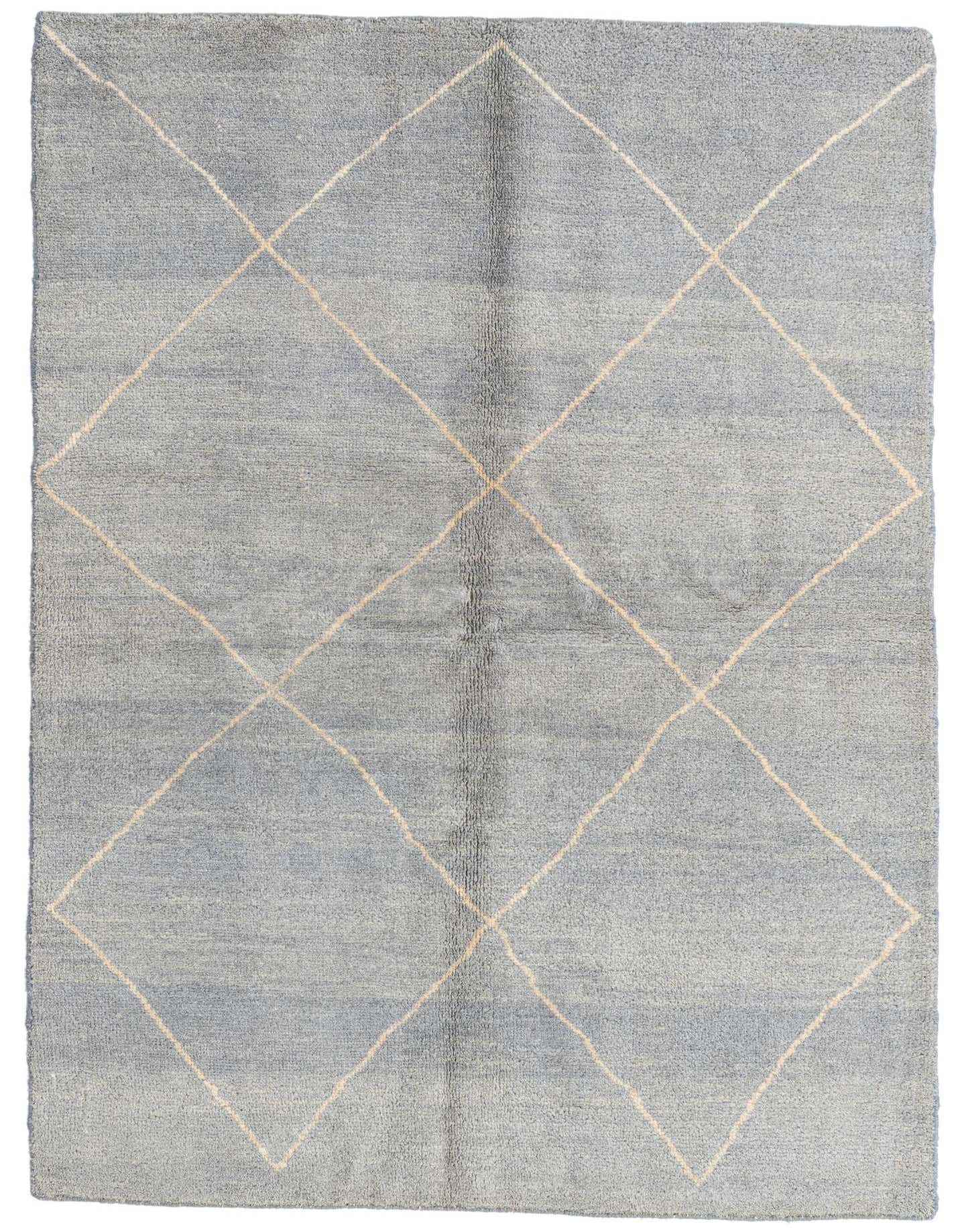 A 4x6 gray rectangular shag rug with a cream tribal diamond pattern, ideal for a living room or bedroom.