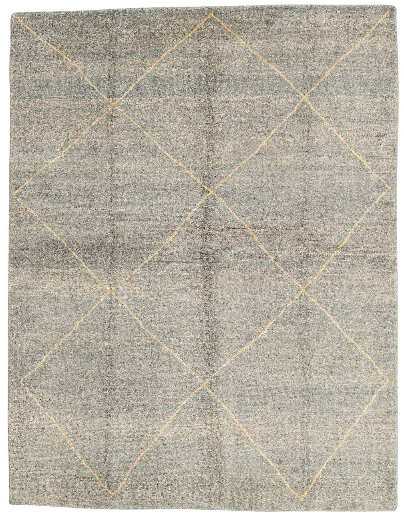 A 6x9 rectangular gray wool shag rug with a modern tribal diamond pattern in light beige, suitable for a living room or bedroom.