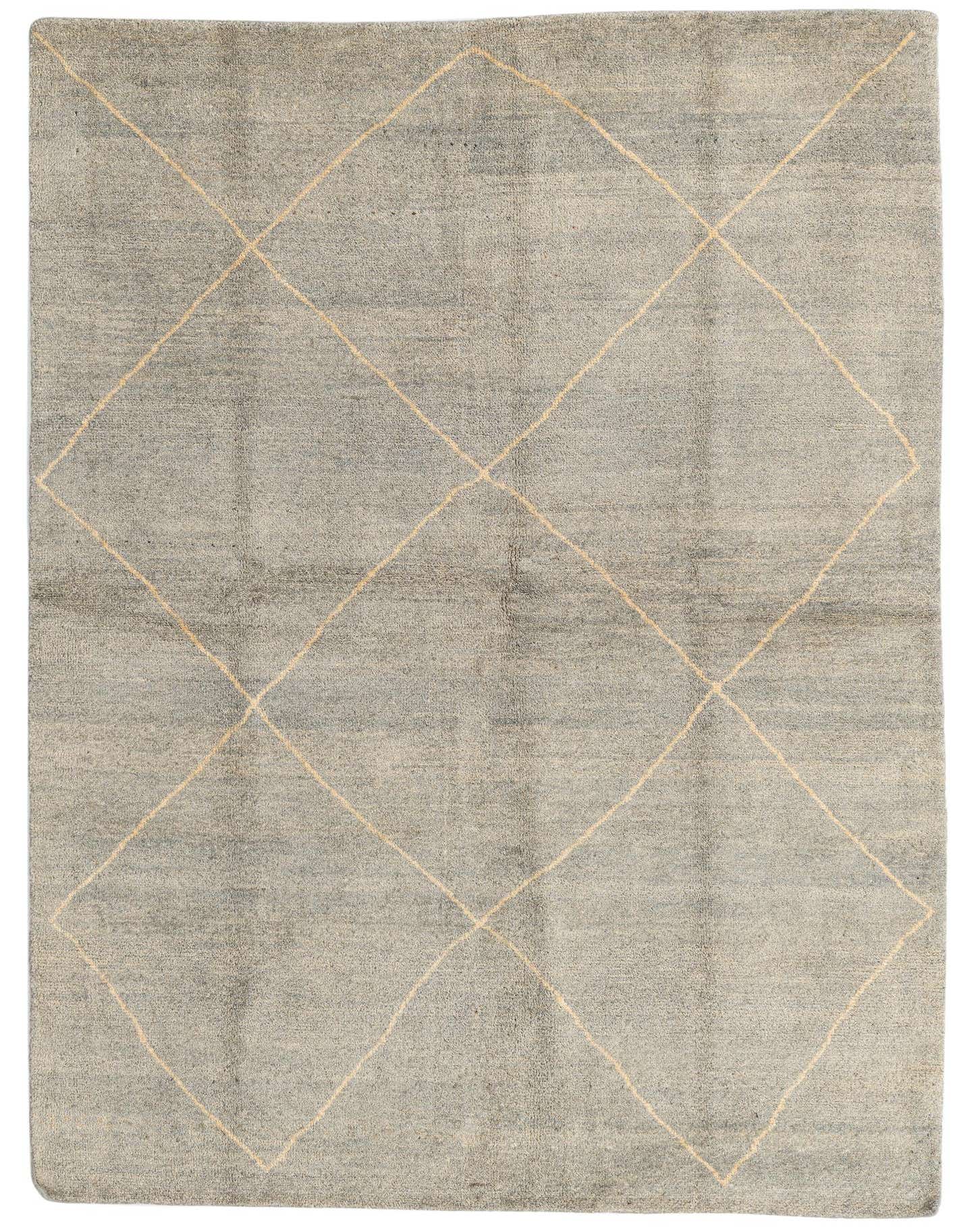 A 6x9 rectangular gray wool shag rug with a subtle cream diamond tribal pattern, perfect for a living room.