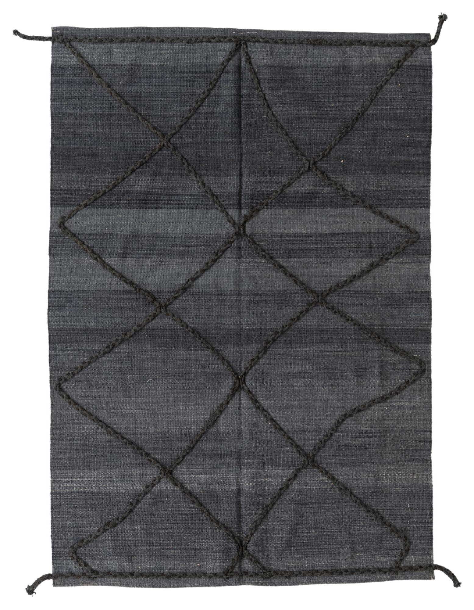 A 4x6 rectangular gray wool shag rug with a dark gray tribal diamond pattern, suitable for a living room.