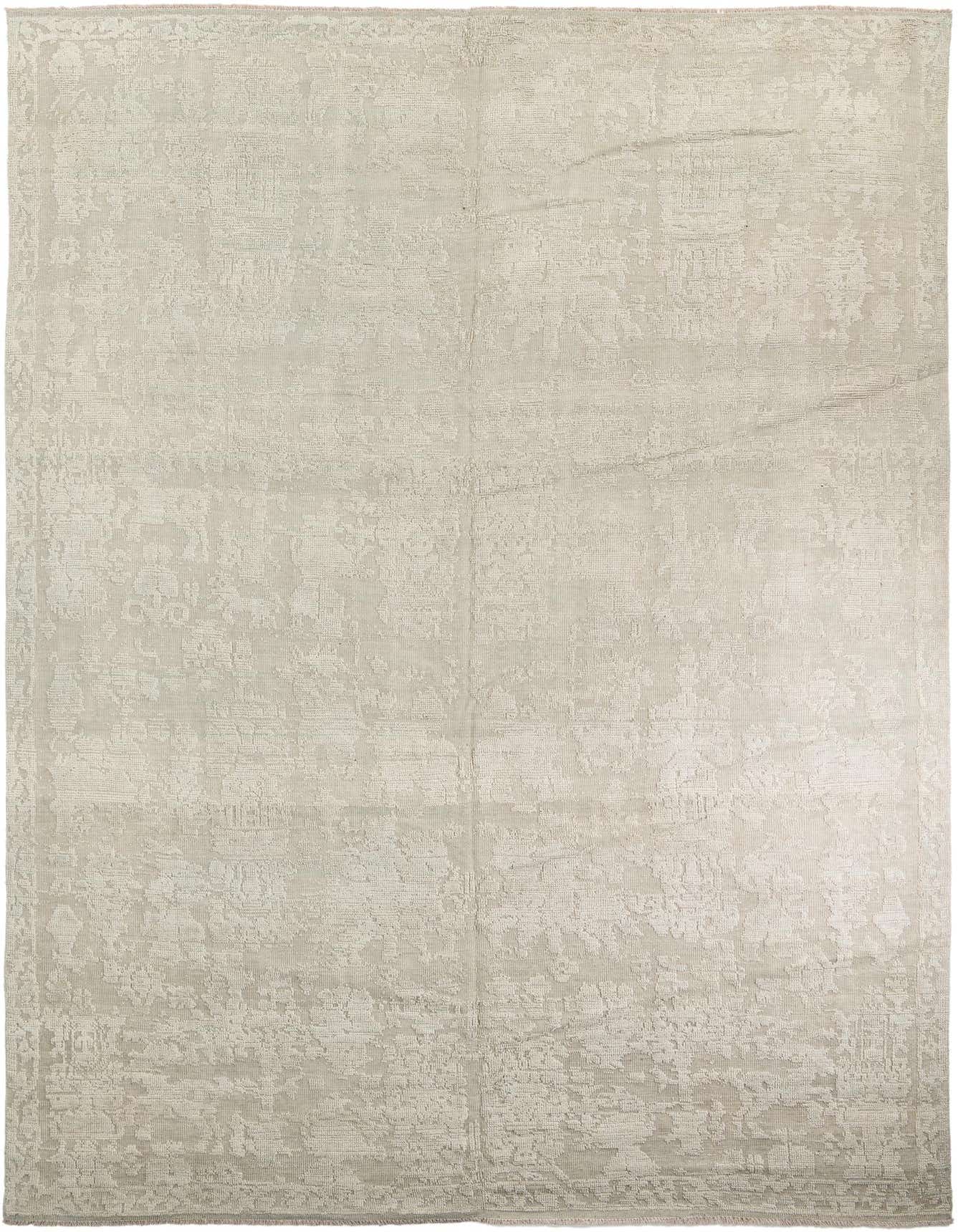 A large 10x16 rectangular gray wool shag rug with a subtle tribal and modern oriental pattern.