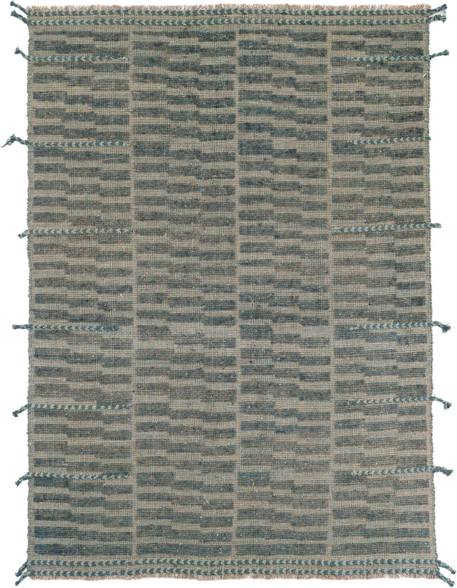 A 5x8 rectangular gray wool shag rug with a modern tribal stripe pattern and decorative tassels.