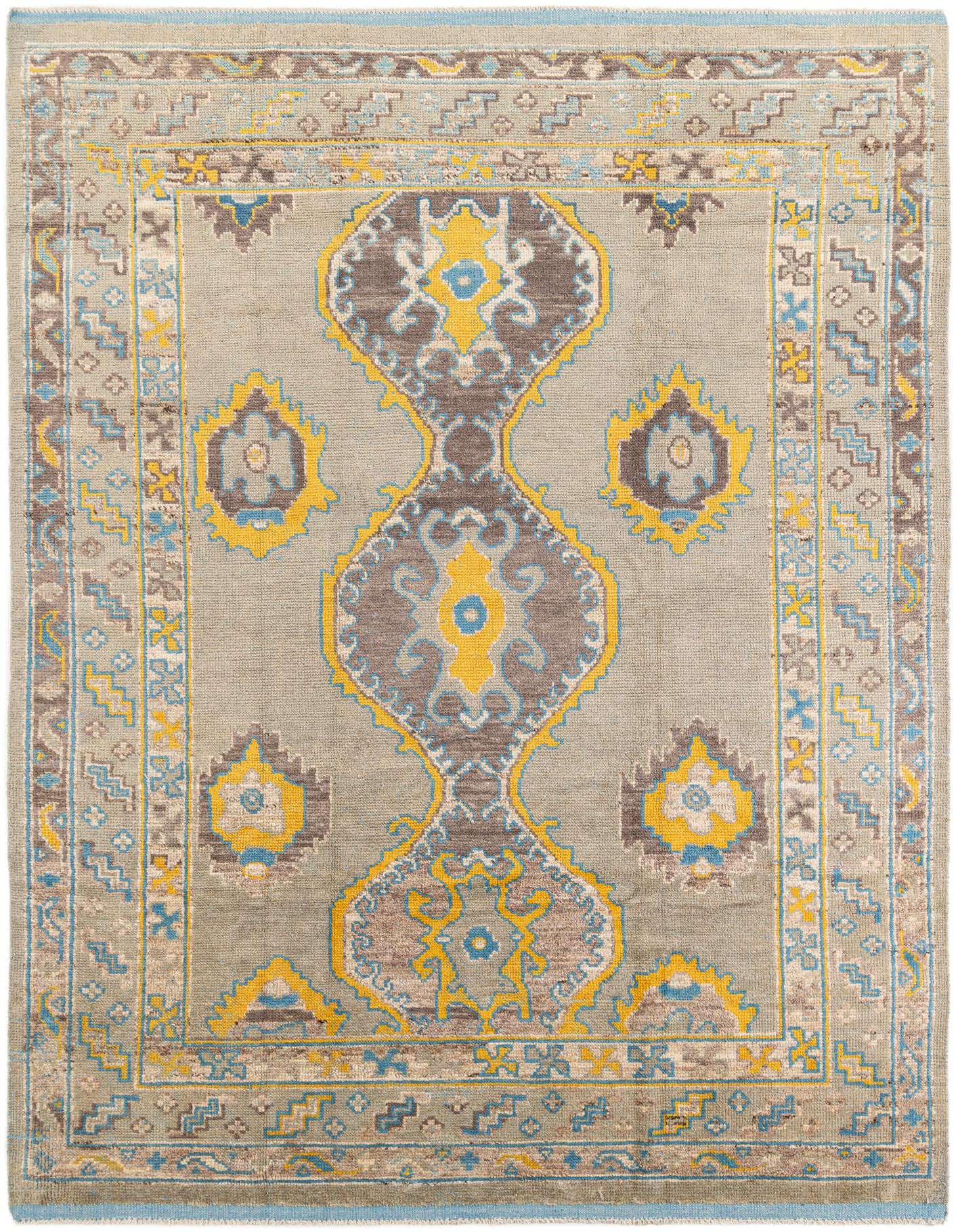A 9x12 rectangular gray Moroccan tribal rug with a central medallion and intricate patterns in yellow, blue, and brown.