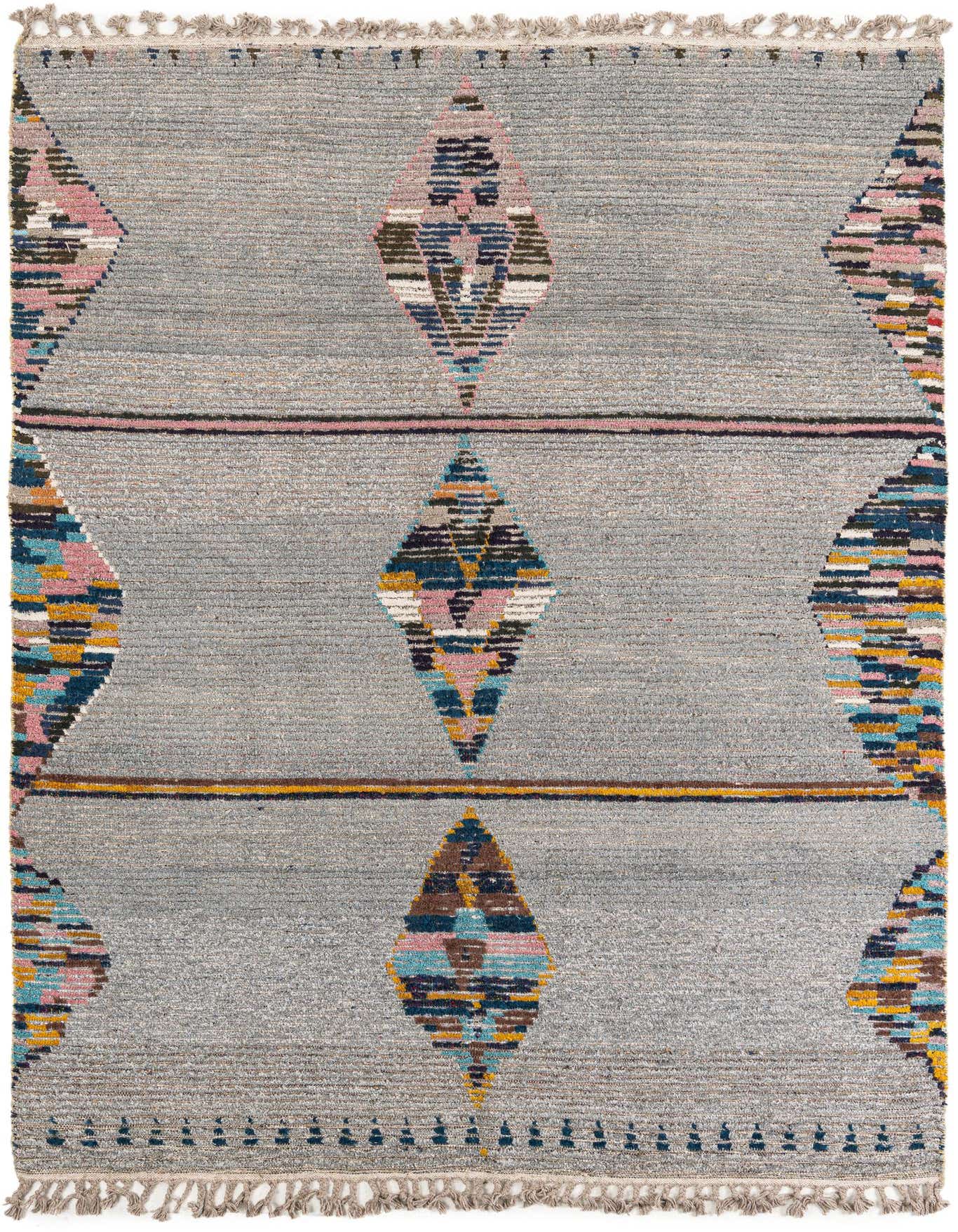 A 6x9 rectangular gray wool shag rug with colorful tribal diamond patterns in pink, blue, and yellow.