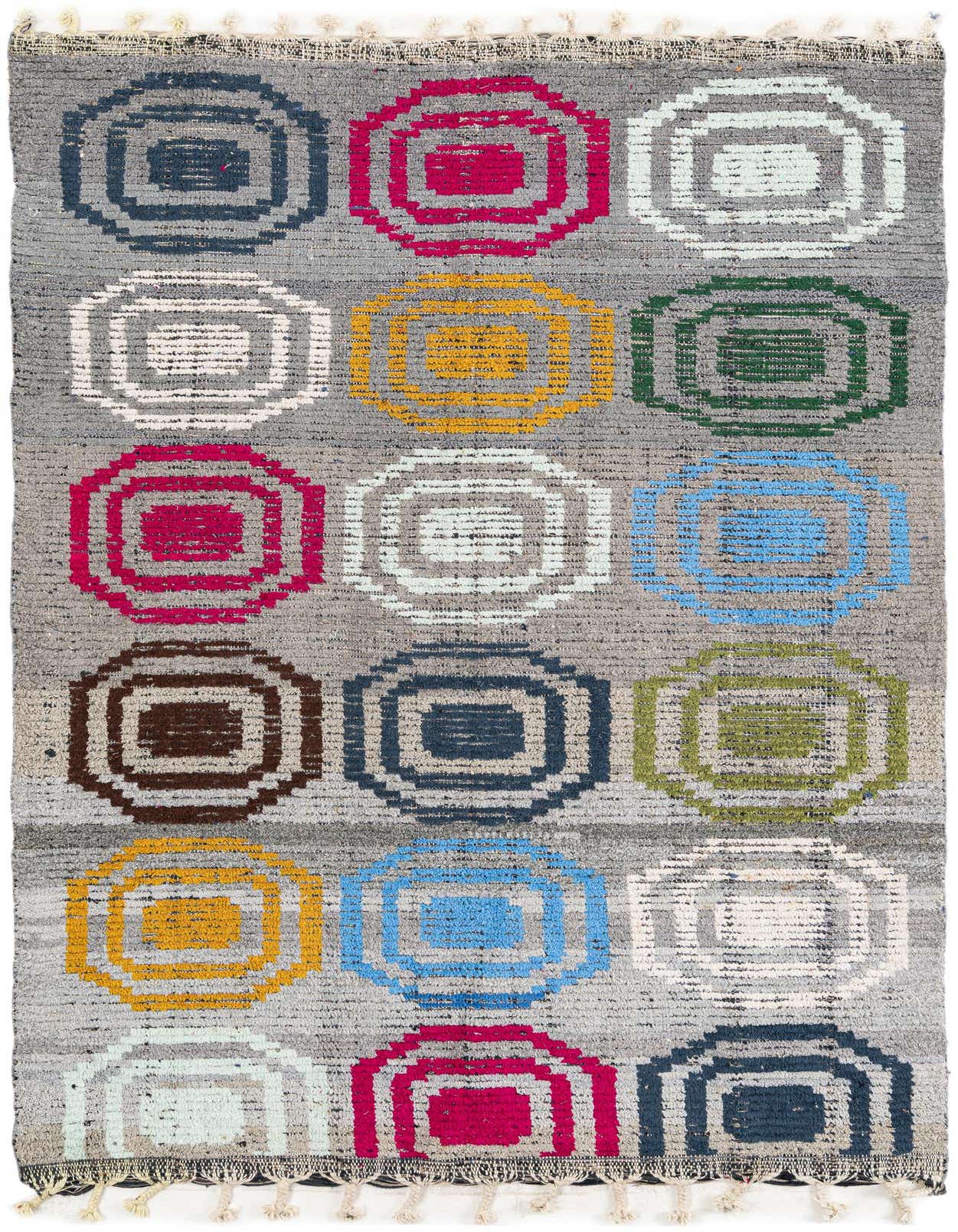 A 5x8 rectangular gray shag rug with a modern tribal pattern of colorful concentric squares in pink, blue, yellow, green, and white.