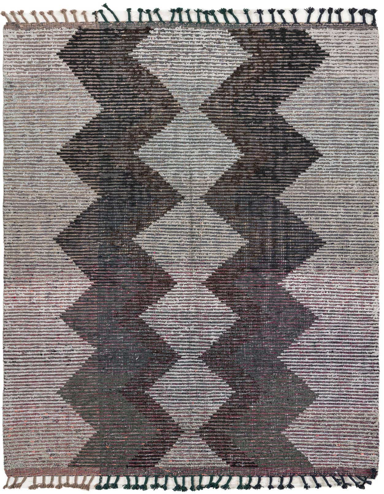A 5x8 rectangular gray wool shag rug with a bold tribal zigzag pattern in varying shades of gray, black, and subtle maroon.