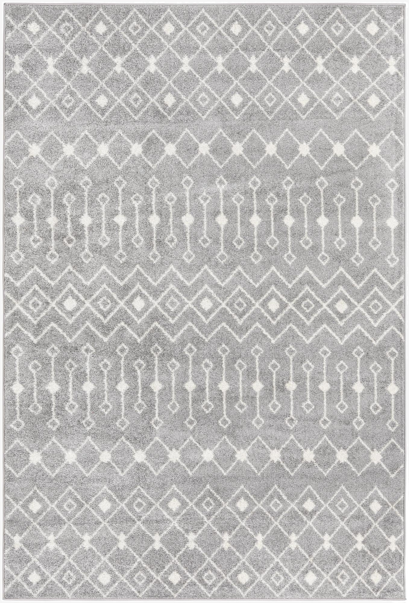 A 6x9 rectangular gray Moroccan Trellis area rug with a repeating diamond and zigzag pattern in white, suitable for a living room.
