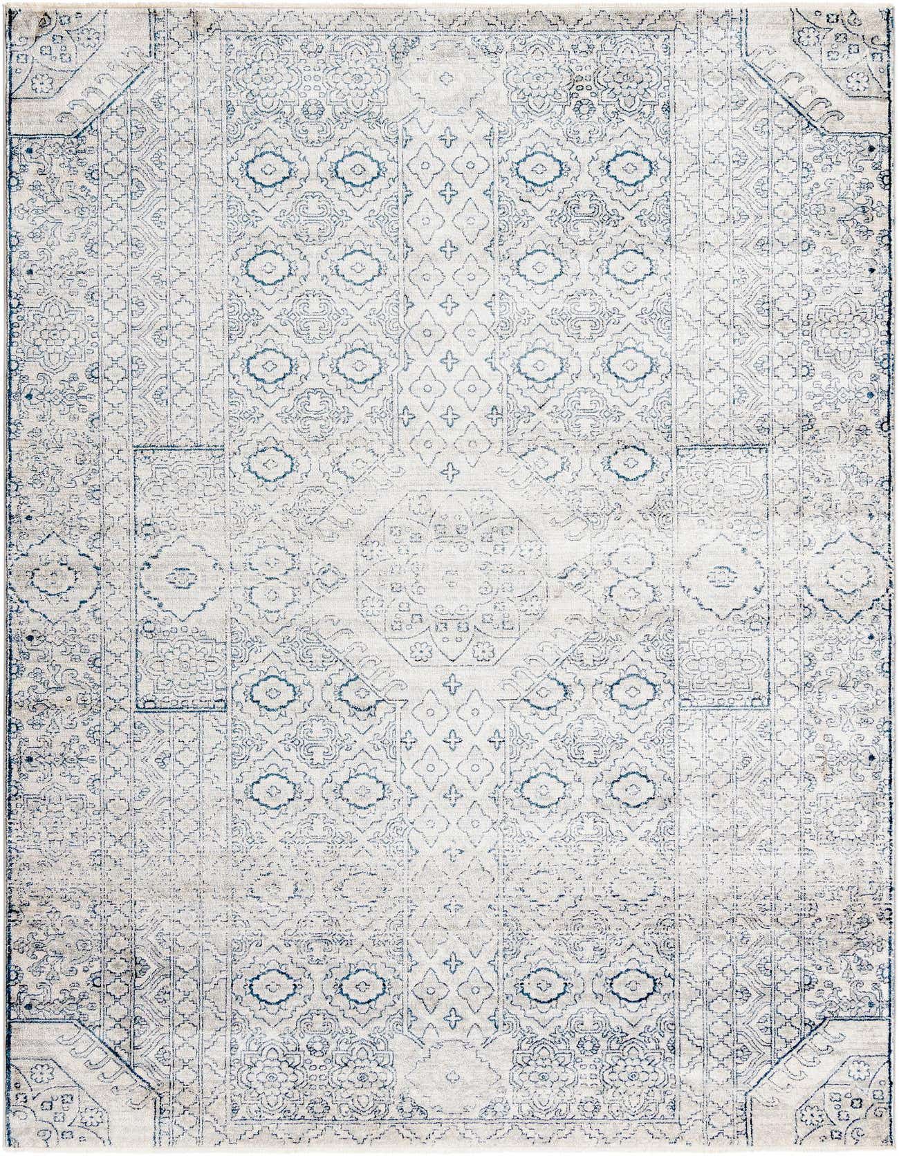 A 6x9 rectangular gray and silver rug with a faded traditional medallion and tribal pattern, suitable for a living room.