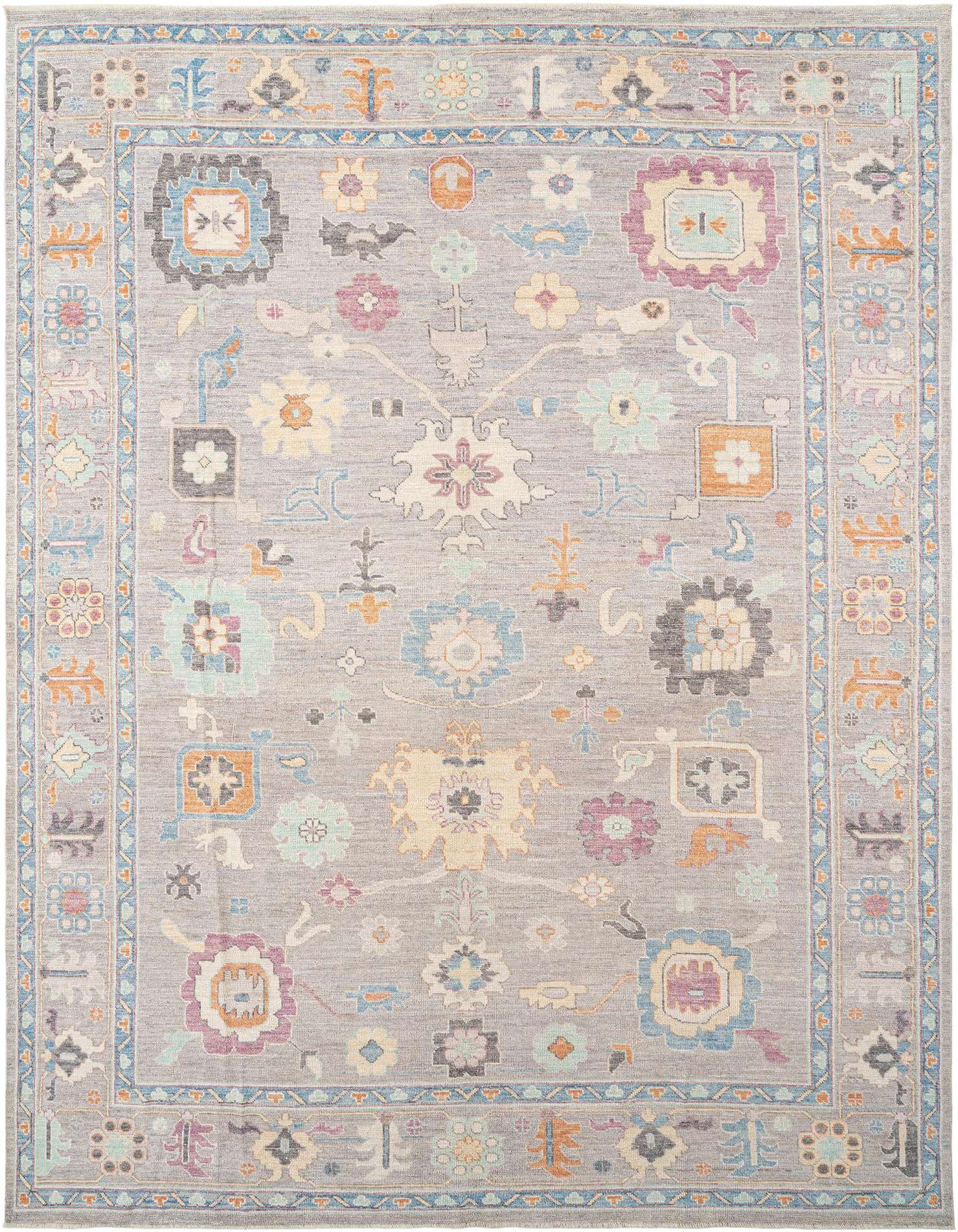 A rectangular gray Persian Oushak rug with colorful floral and geometric motifs in blue, orange, purple, and cream.