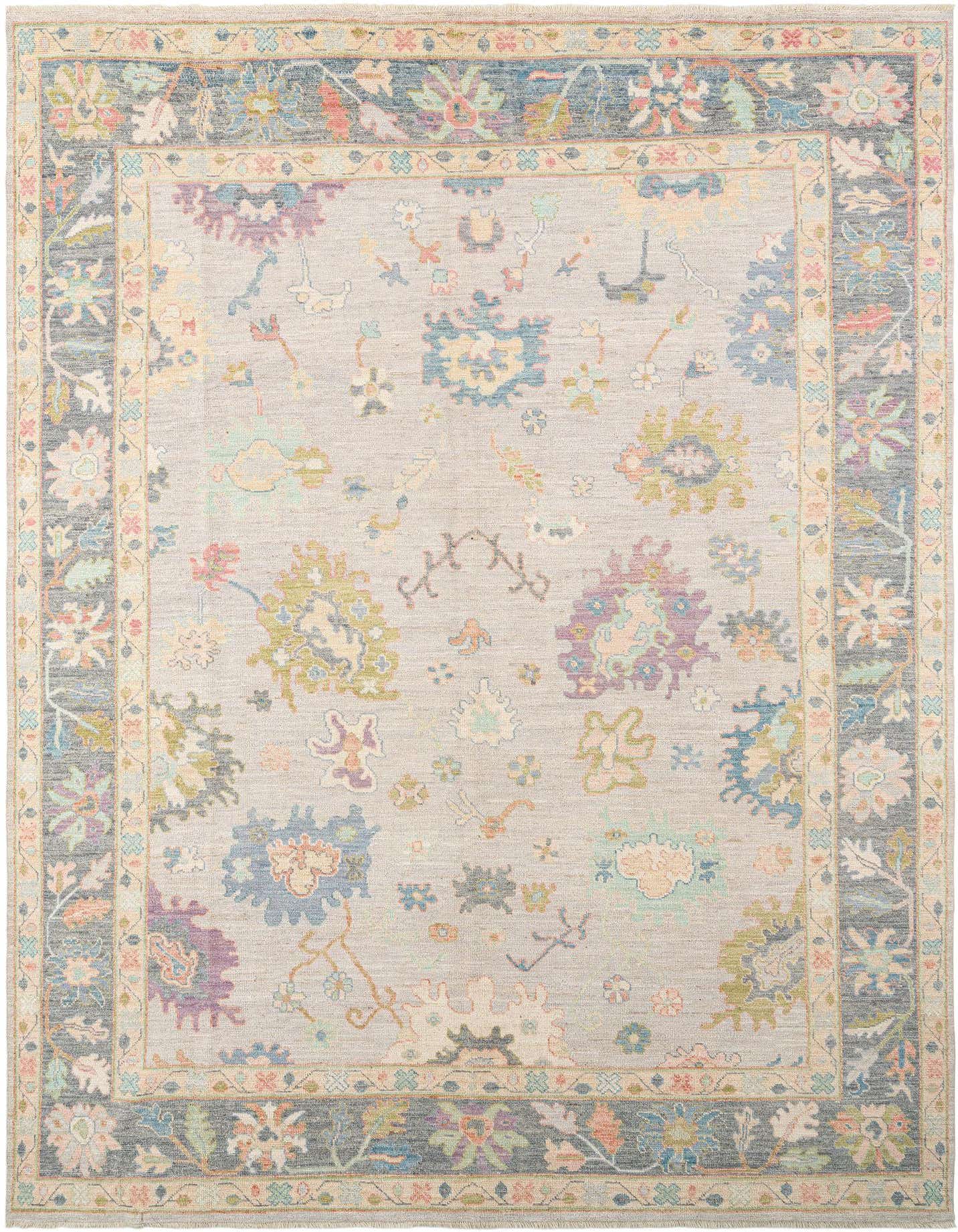 Handmade rectangular Oushak rug featuring a light gray field with scattered floral motifs in muted pastels, framed by a dark gray border with intricate Persian patterns.