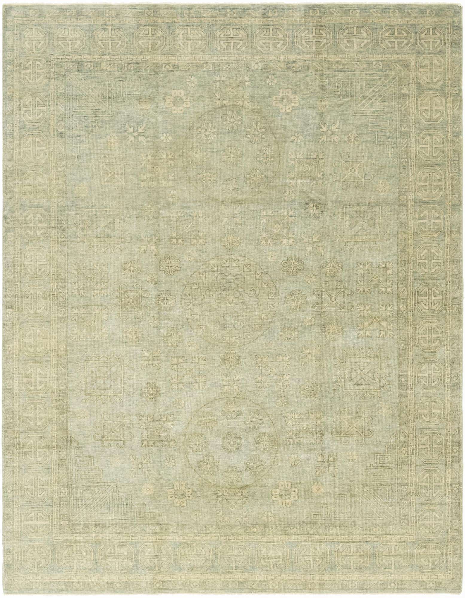 An 8x10 rectangular gray wool Oushak rug with a transitional tribal pattern and decorative border.