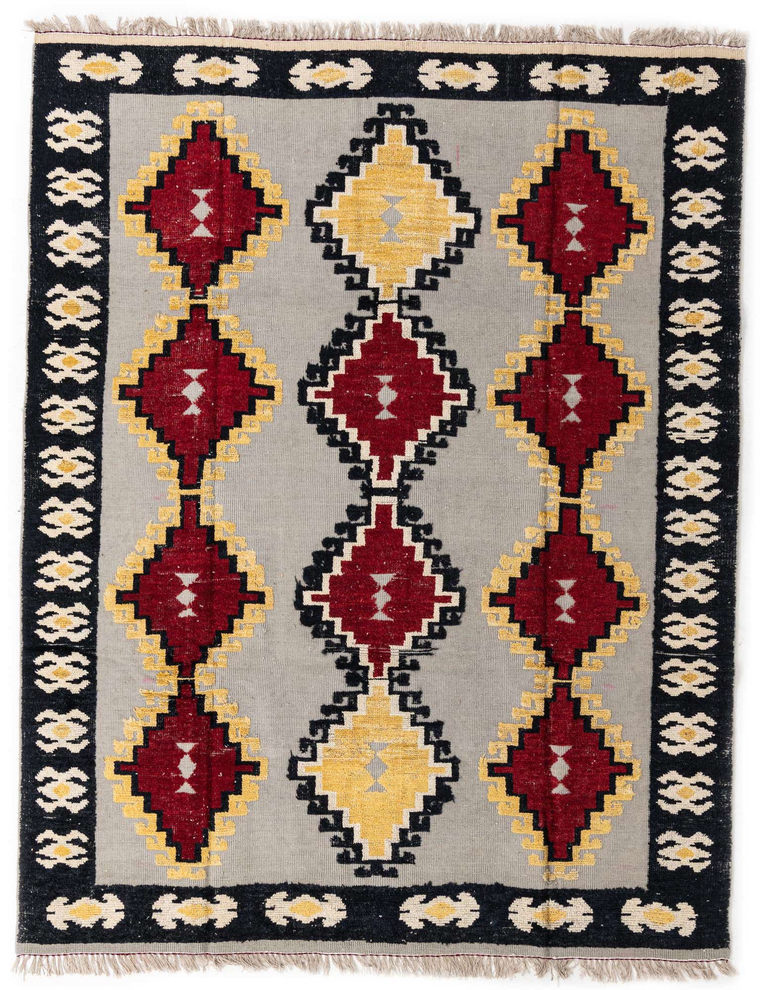 An 8x10 rectangular gray wool rug with a modern abstract pattern of red, yellow, and black diamonds.