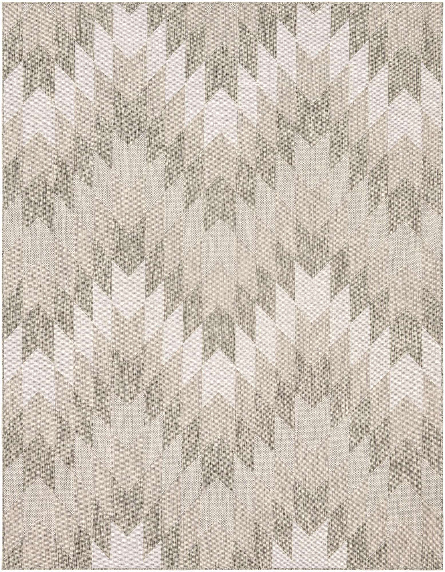 An 8x10 rectangular flatweave rug featuring a modern tribal zigzag pattern in varying shades of gray and silver.