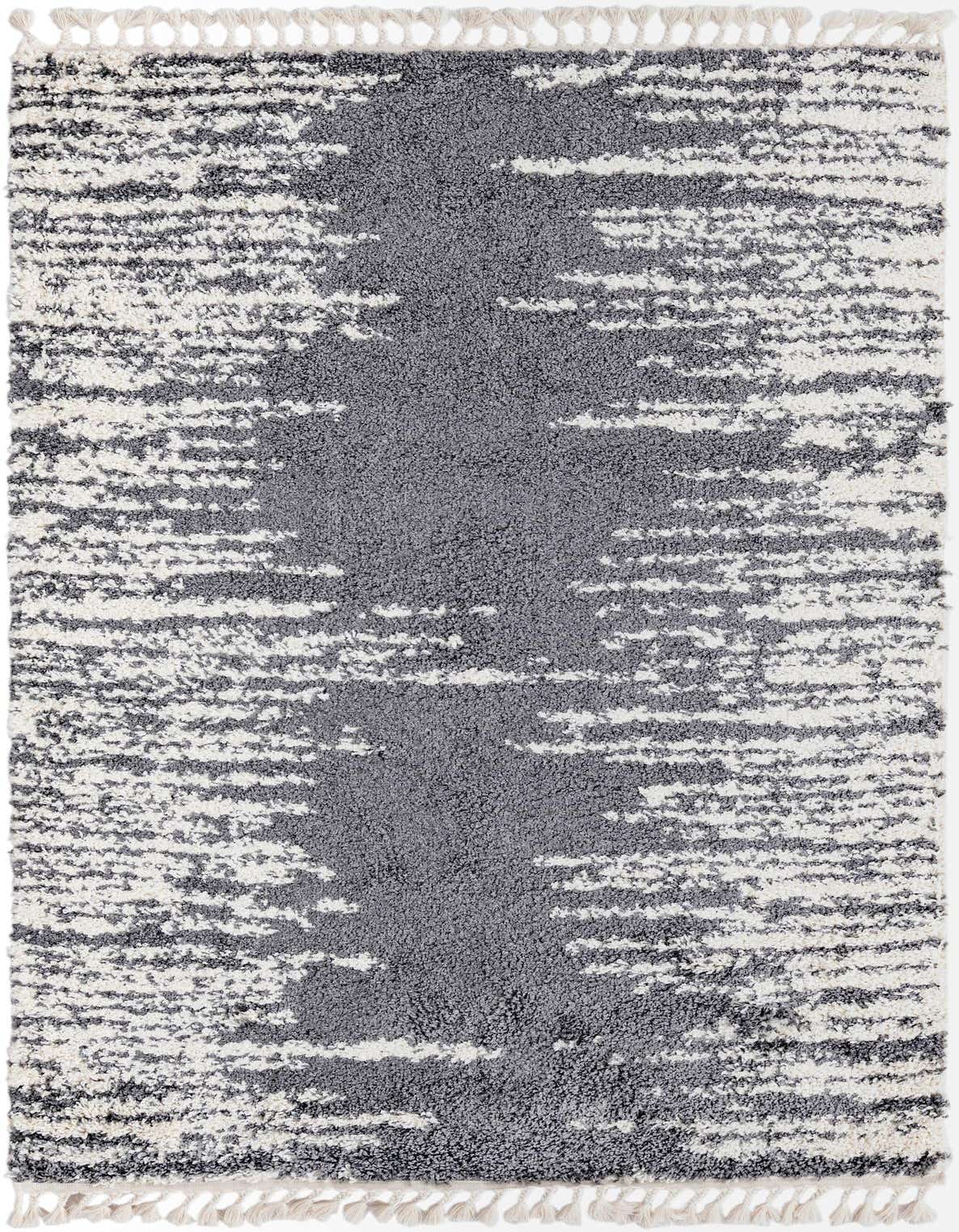 A 5x8 rectangular gray and white shag rug with an abstract, textured pattern and decorative tassels.