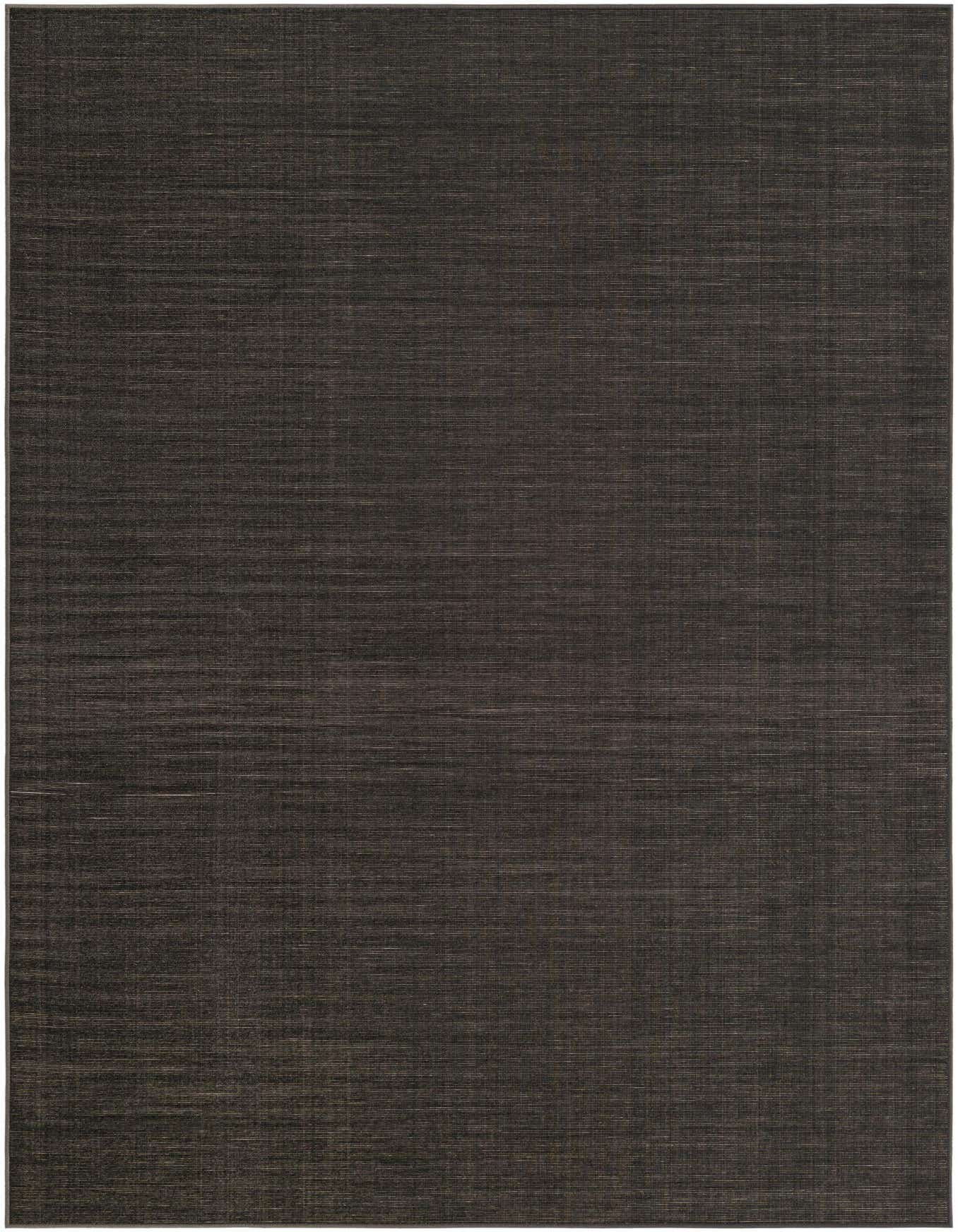 A 6x9 rectangular SoHo Collection rug in a dark gray, almost black, with subtle horizontal striations, showcasing its flat weave and urban style.