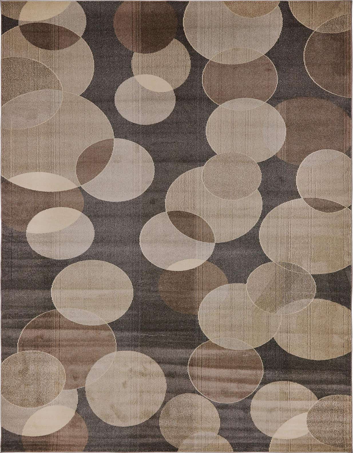 A rectangular gray and silver modern abstract rug with overlapping circles in various shades of gray and beige.