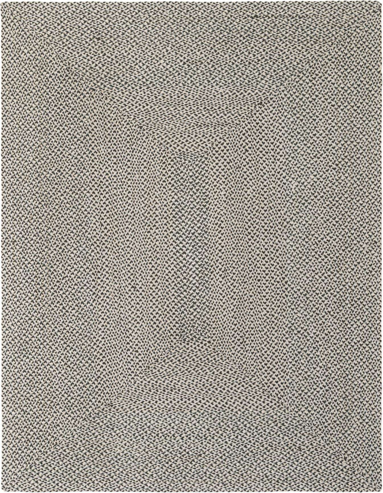 A 6x9 rectangular gray Tweed Braided Jute rug with a textured, modern pattern, suitable for a living room.