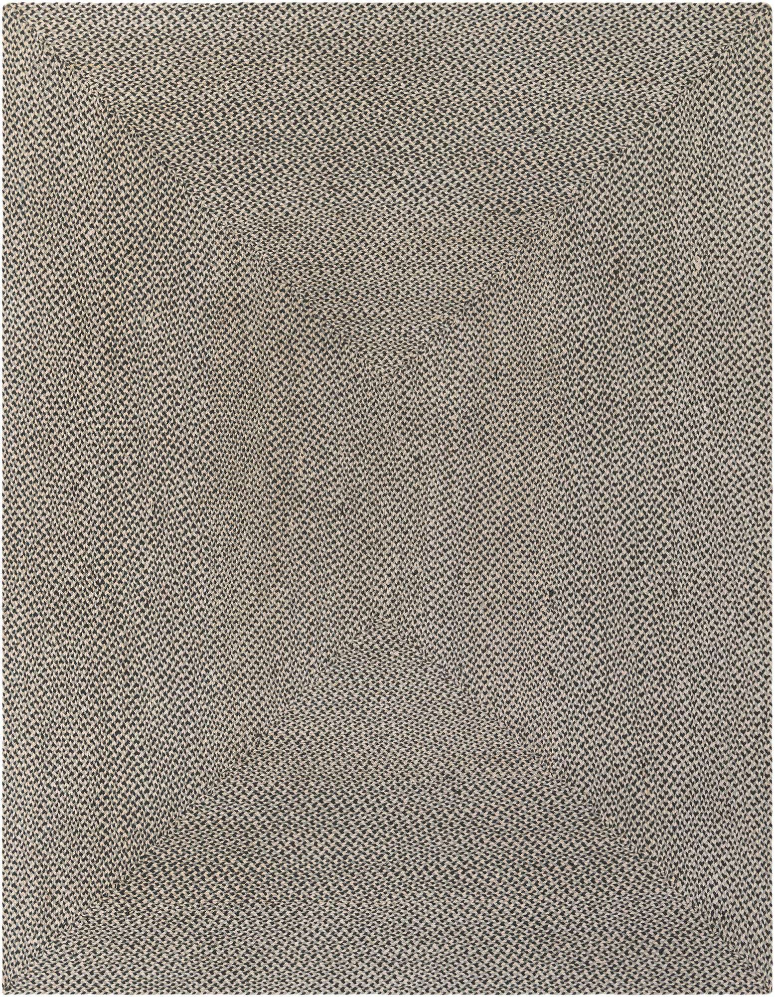 A close-up view of an 8x10 rectangular Rugs.com Tweed Braided Jute rug, showcasing its tightly woven gray and silver fibers.