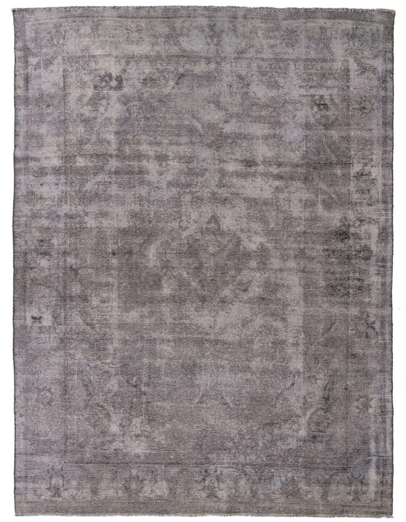 A 7x10 rectangular gray wool rug featuring a distressed Persian medallion pattern, suitable for a living room.