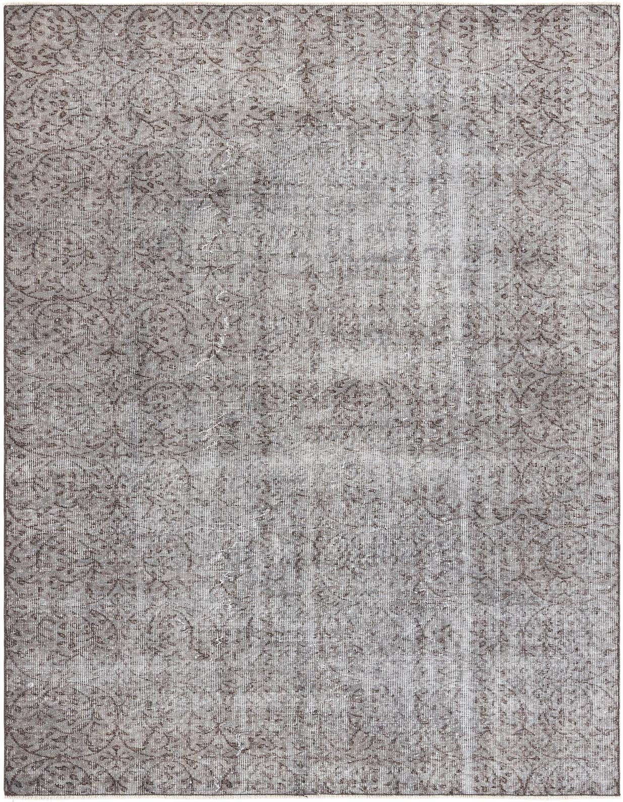 A 5x8 rectangular gray and silver wool rug with a subtle vintage Persian pattern, suitable for a living room.