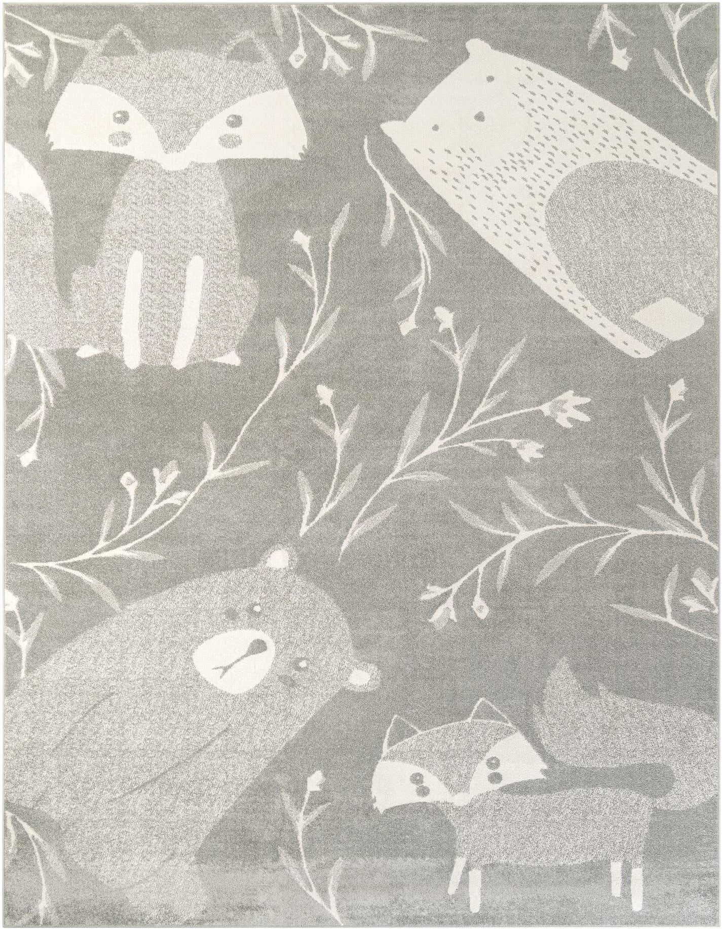 A gray rectangular rug with a modern pattern of white cartoon forest animals like foxes and bears, surrounded by delicate white foliage.