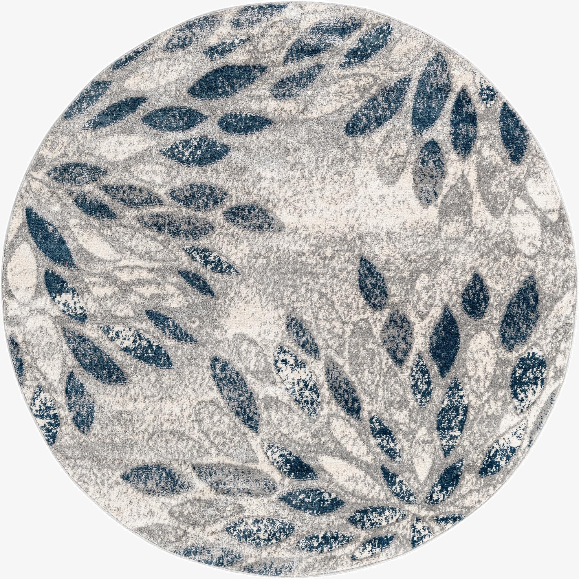 A 6' round gray rug with a modern floral pattern featuring abstract navy blue and light gray leaves.