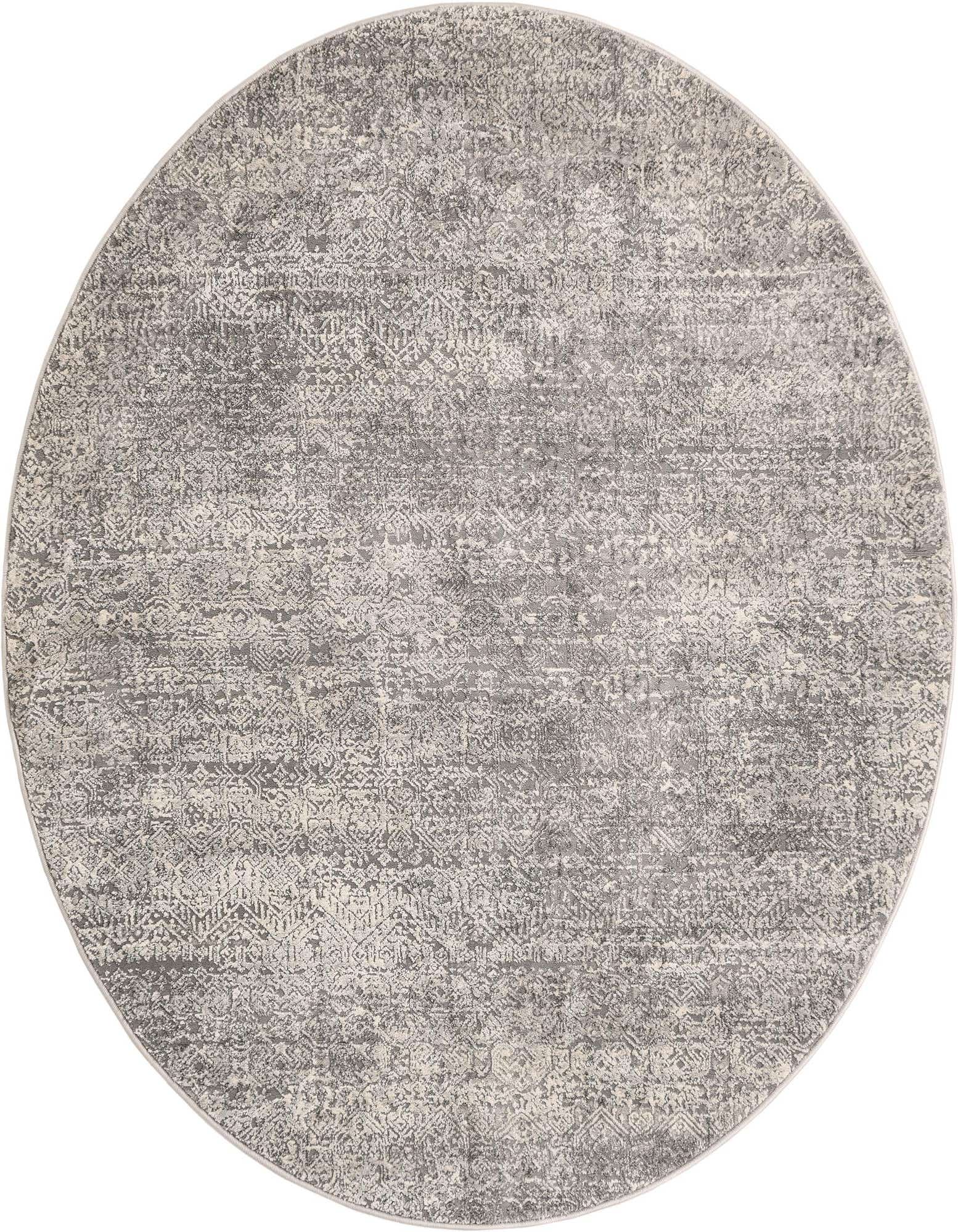 A 5' 3 round gray area rug with a subtle distressed modern pattern, ideal for an indoor living space.