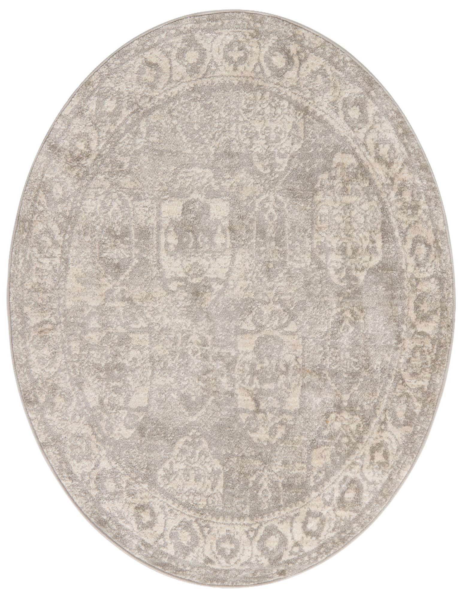A 4' round gray and silver bohemian rug with a distressed traditional pattern and thin pile.