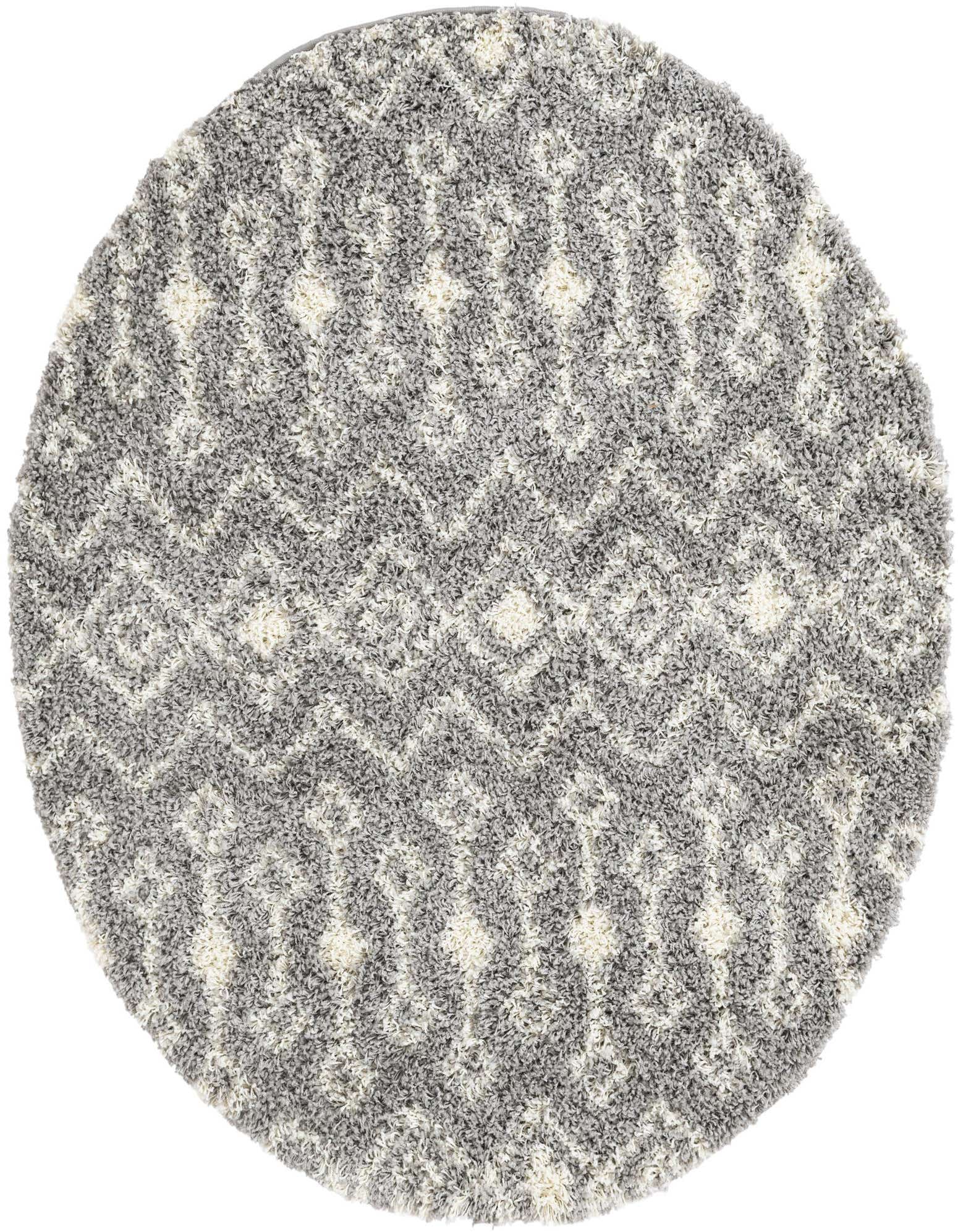 A 5' 3 round gray and white shag rug with a modern tribal trellis pattern, ideal for an indoor living space.
